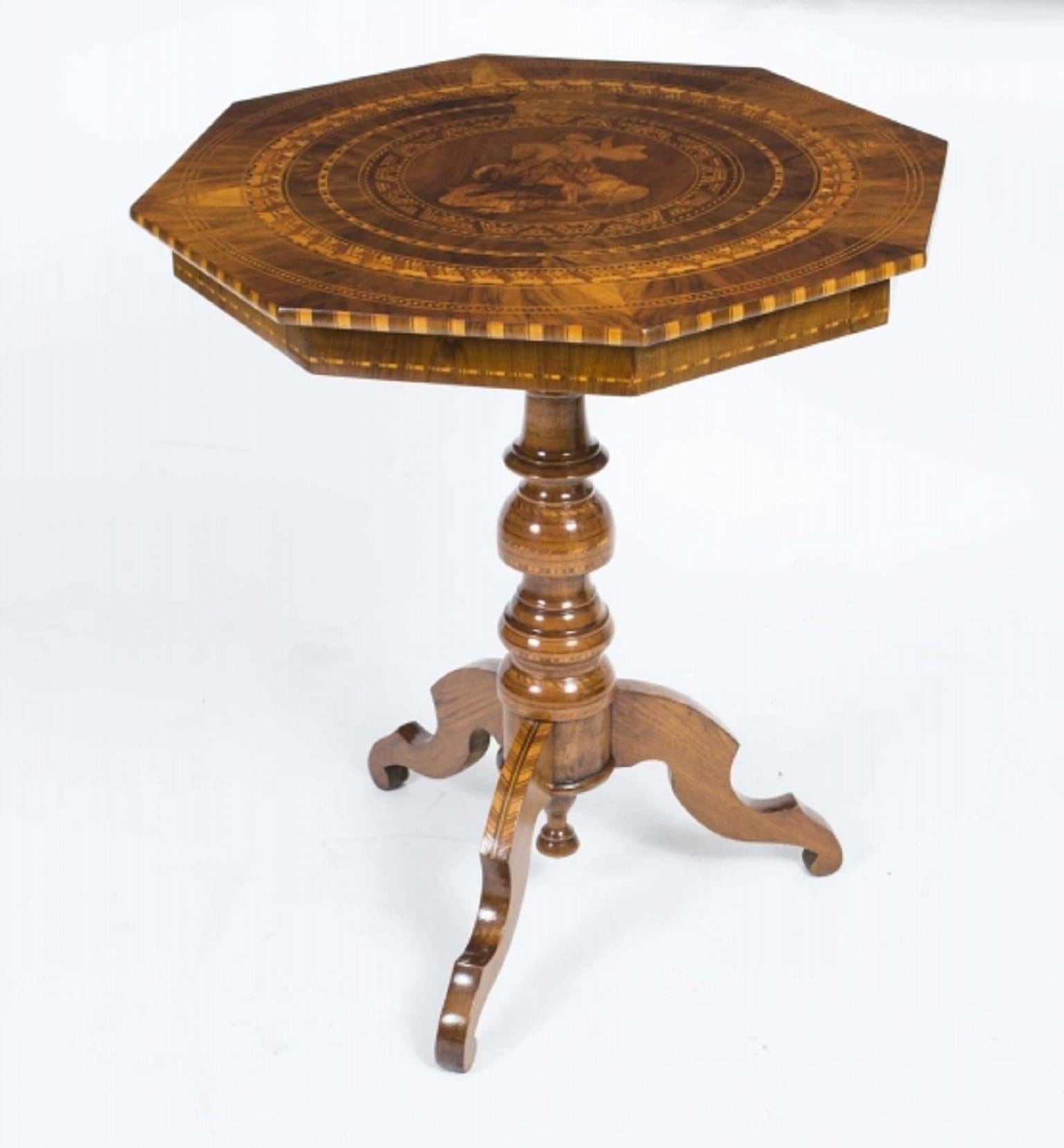 This is a beautiful antique octagonal occasional table from Sorrento in Italy, circa 1860 in date.

It was handcrafted from walnut and olive wood. The base and stem have been masterfully inlaid, in geometric patterns and the top has a wonderful
