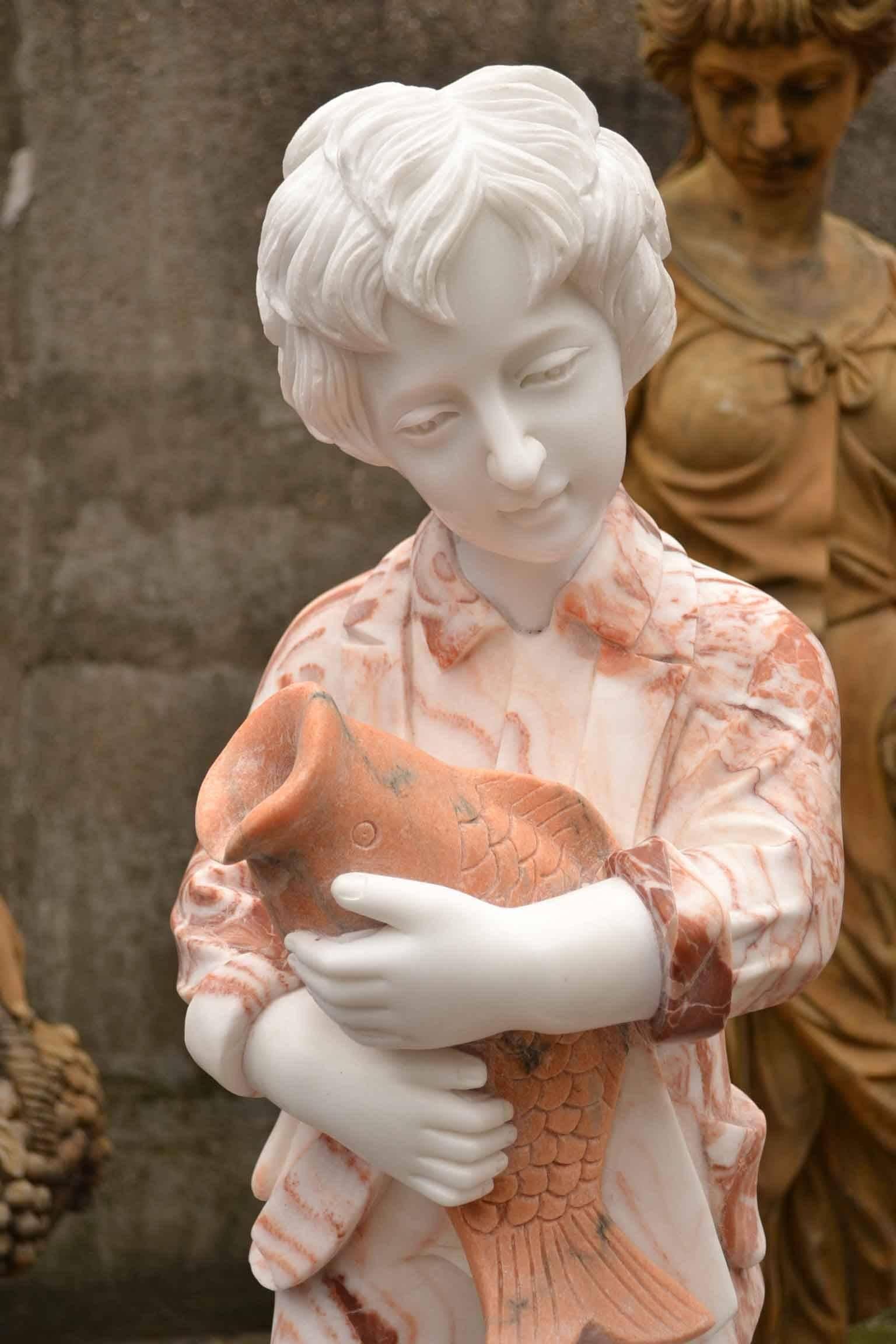 This is a beautiful multi-color marble fountain statue of a young girl with a swan at her feet holding a fish, dating from the last quarter of the 20th century.

This magnificent work of art is hand-carved from solid blocks of Italian Carrara