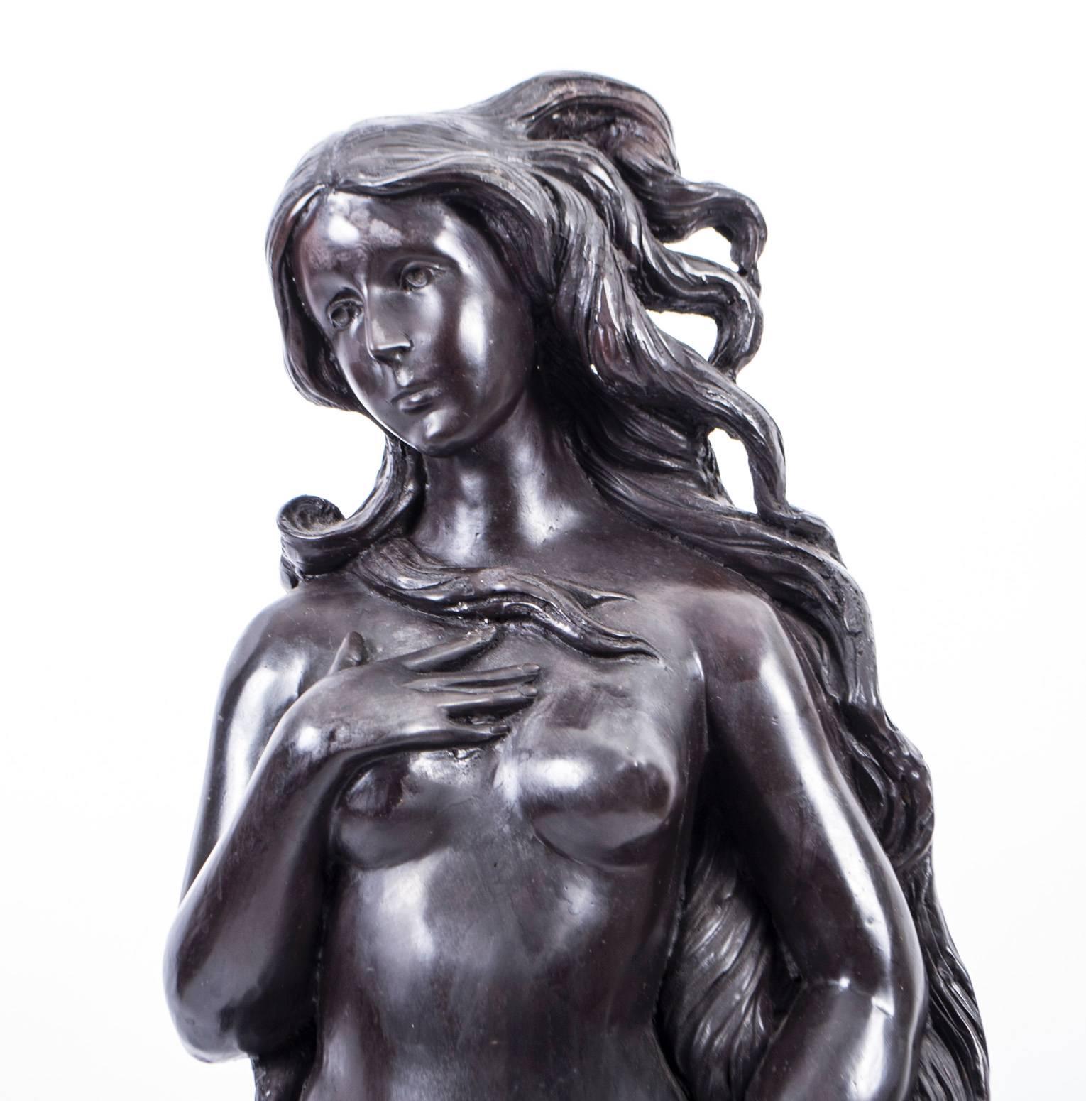 This sculpture depicts the goddess Venus, having emerged from the sea as a fully grown woman, arriving at the sea-shore.

It dates from the last quarter of the 20th century.

This reproduces the Venus depicted in the Italian Renaissance painting by
