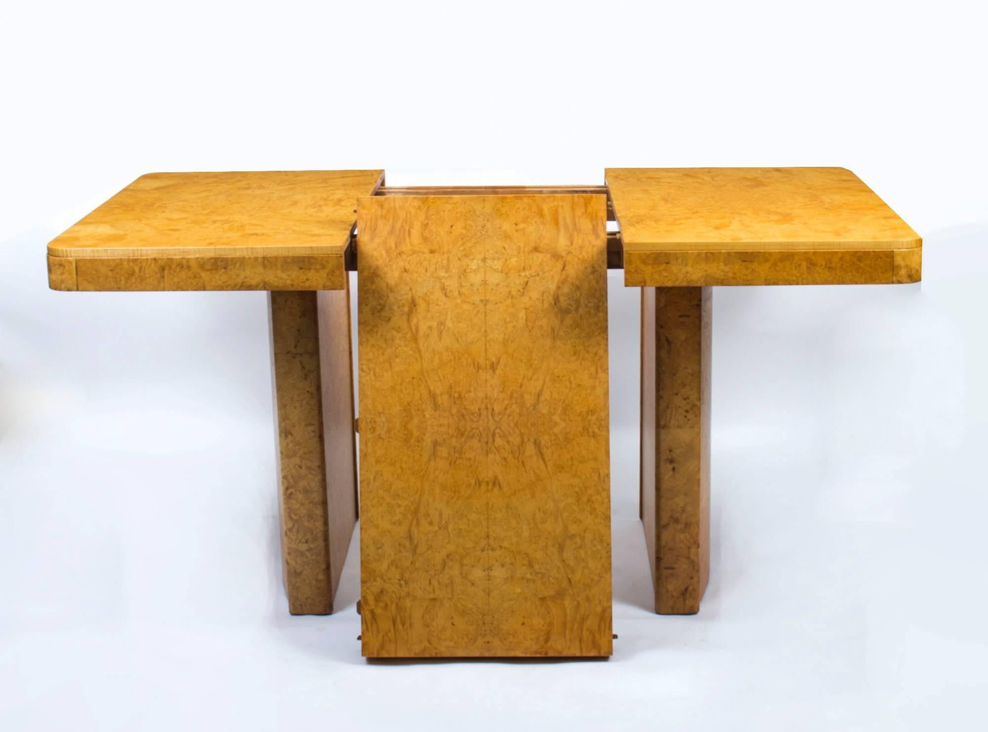 This is a wonderful example of an art deco antique dining table dating from 1930. Crafted in birdseye maple the table has rounded corners and is set on twin pedestal legs.

This art deco antique dining table can be extended by the insertion of a