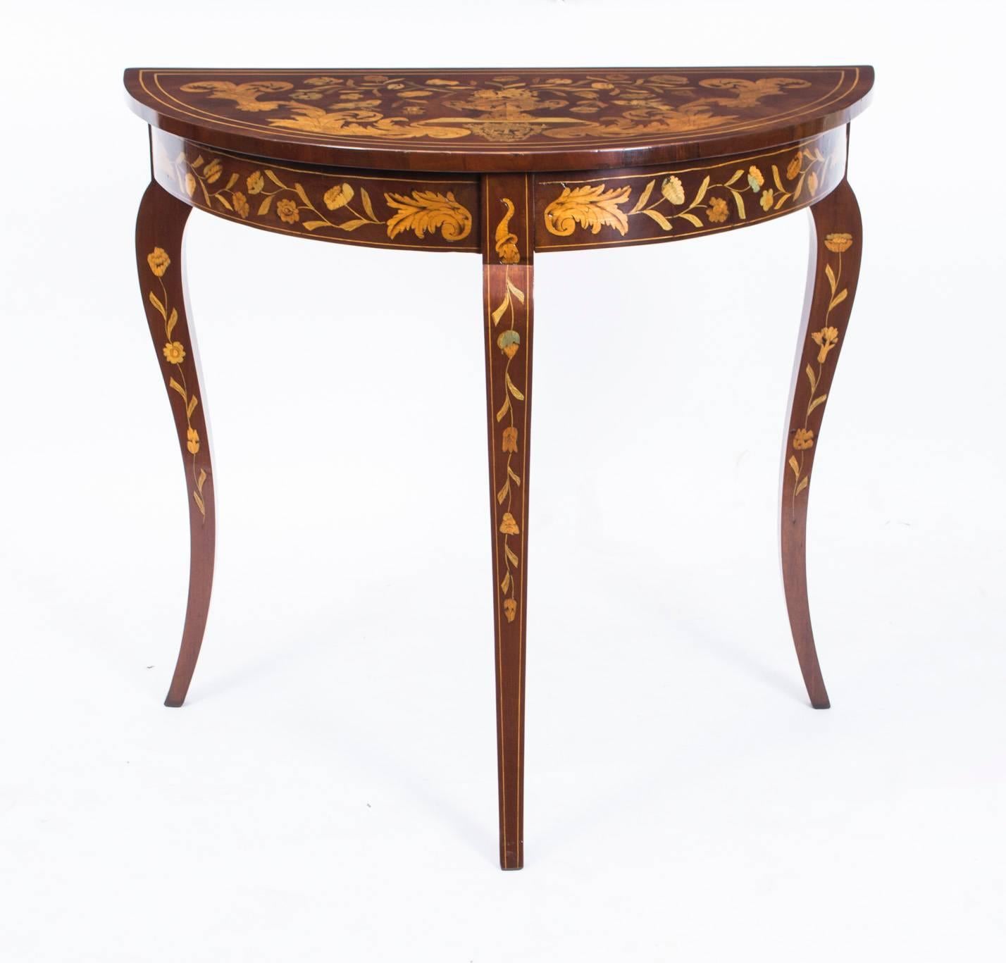 This is a beautifully crafted antique Dutch marquetry console table, circa 1780 in date.
 
This antique console is made from the finest quality walnut with satinwood and boxwood inlaid marquetry, forming a composition of a bouquet of flowers in a