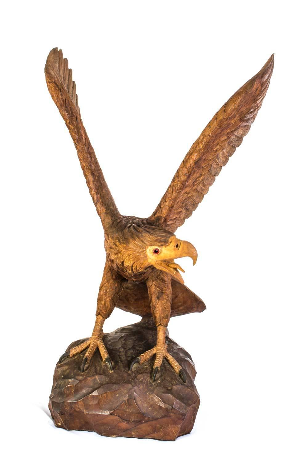 This is a truly impressive and enormous eagle with fully spread wings, dating from the last quarter of the 20th century.

It was hand-carved from mahogany.

The attention to detail is absolutely fantastic and really brings him to life.

The