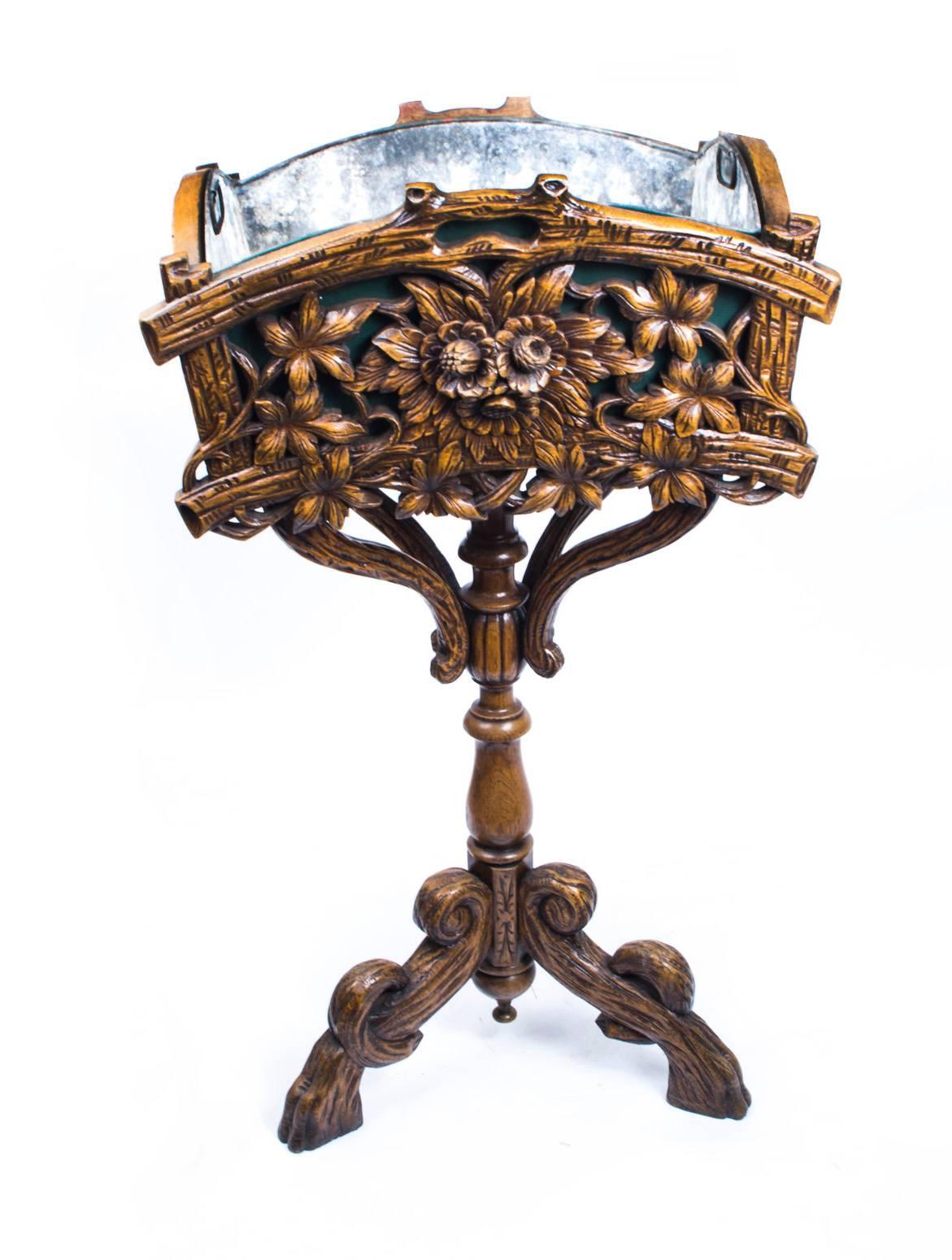 This gorgeous antique jardiniere was painstakingly hand-carved from linden wood, circa 1880.

It has its original lead liner and would be fabulous when used as a jardiniere for your plants, could also be used as a cooler, when filled with ice, for