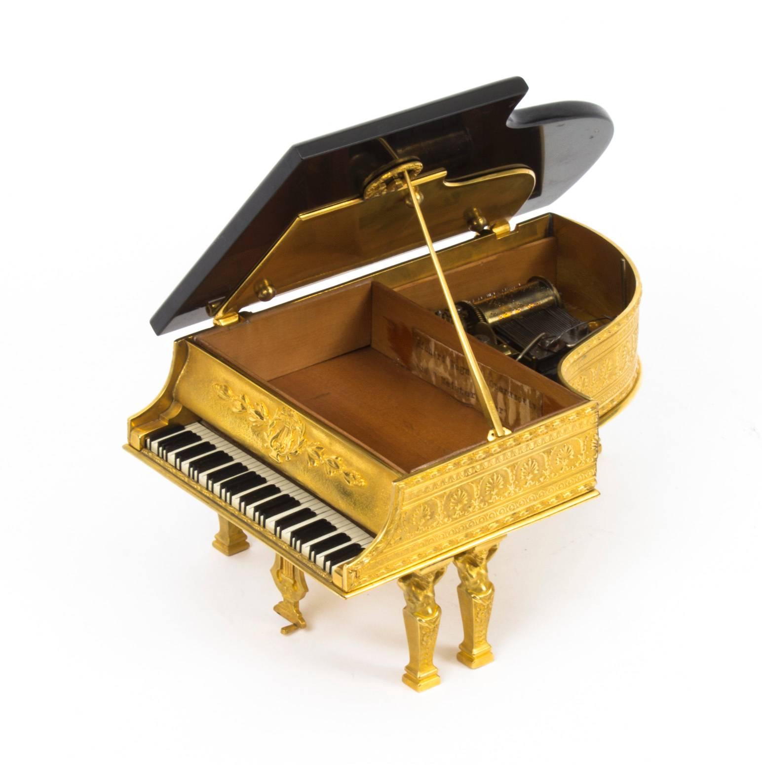 A superb Viennese ormolu piano musical jewellery box, the underside stamped with the makers name, G.Brehmer, Vienna Austria, circa 1870 in date.

This delightful casket is beautifully decorated with striking embossed decoration and it has a