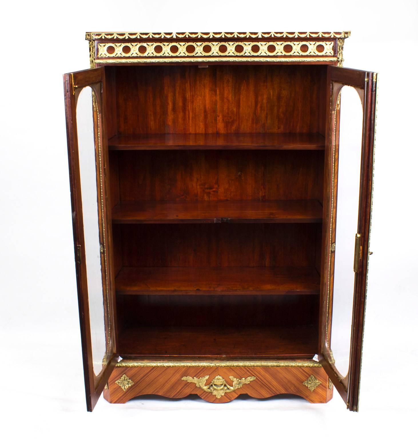 This is a beautiful Victorian burr walnut and tulipwood double door low display cabinet, circa 1860 in date.

It has been accomplished in the very best quality burr walnut with fabulous crossbanded decoration and elegant ormolu mounts.

The pair of