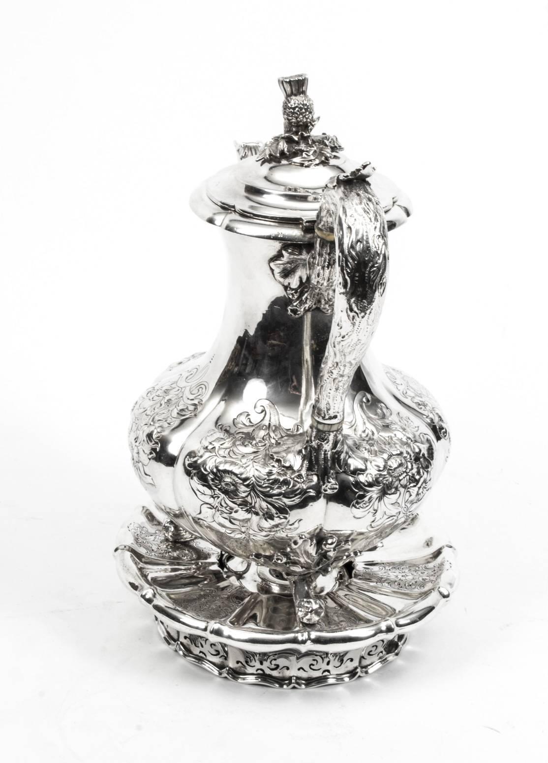 This is a wonderful and rare English antique sterling silver coffee pot on stand by the world famous silversmith Paul Storr.

It has hallmarks for London, 1837 and the makers mark of the celebrated silversmith Paul Storr, with embossed and