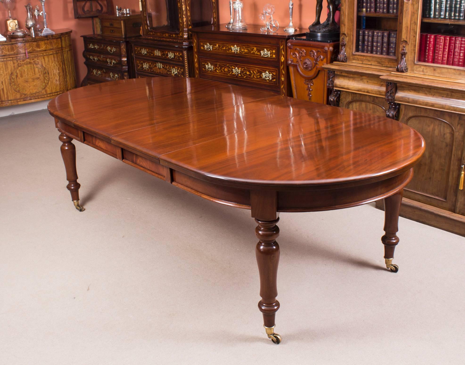 This is a fabulous dining set comprising an antique Victorian mahogany rounded rectangular extending dining table, circa 1880 in date with a set of eight Victorian style admiralty back dining chairs dating from the late 20th century.

The table