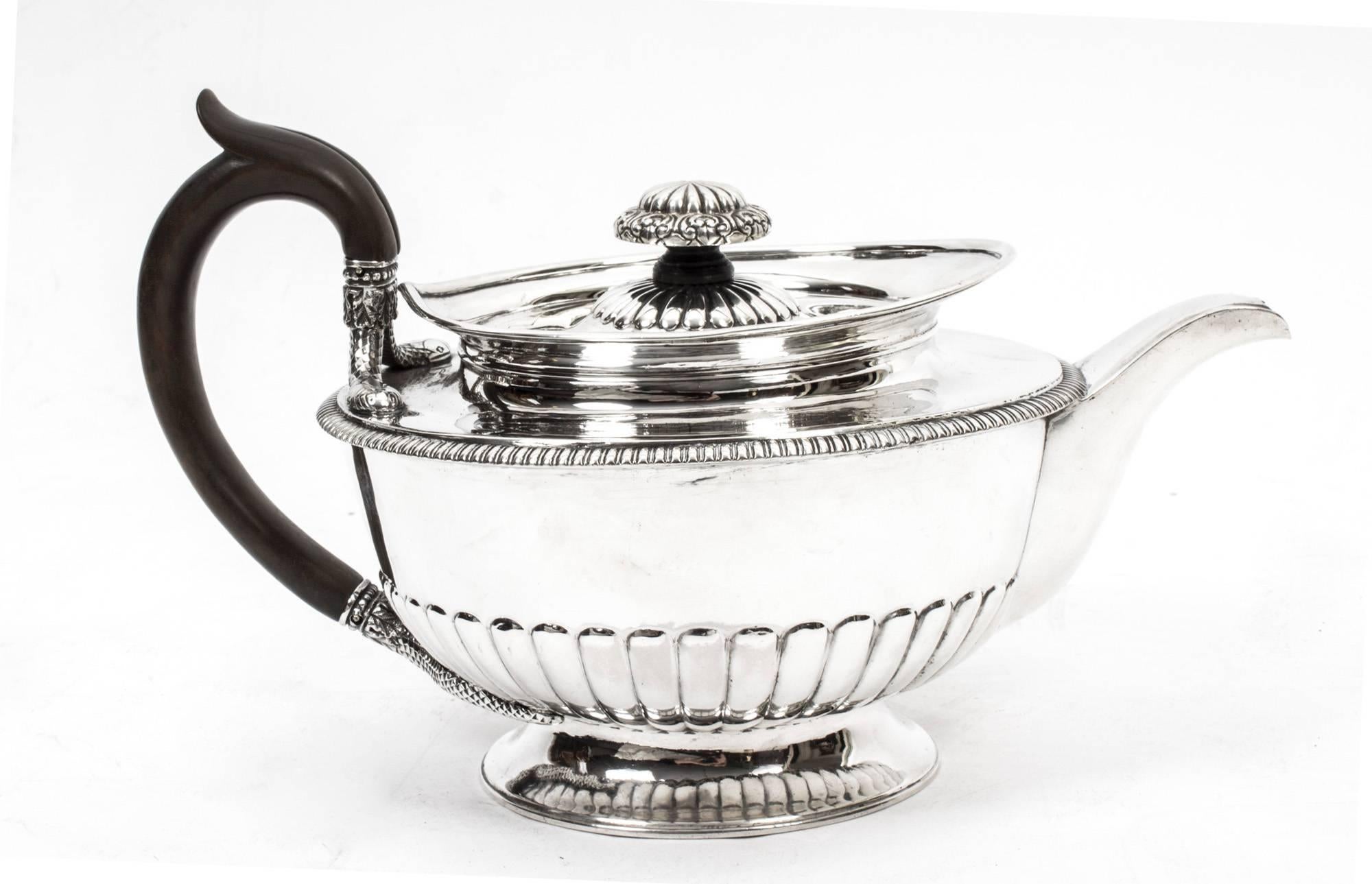 This is a fabulous antique sterling silver teapot with hallmarks for London, 1809, and the makers mark of one of the most celebrated silversmiths of all time, Paul Storr. 

With superb embossed and engraved decoration, note the serpent handles,
