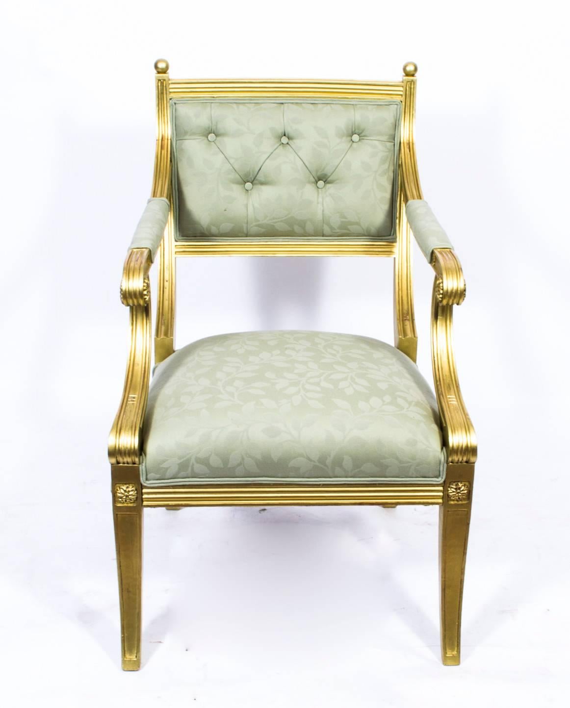 This is a beautiful antique giltwood armchair, in the fabulous Regency style, and early 20th century in date. 

The gilded chair has been beautifully carved with reeded lines and medallion plaques. The arms and supports scroll out in exaggerated