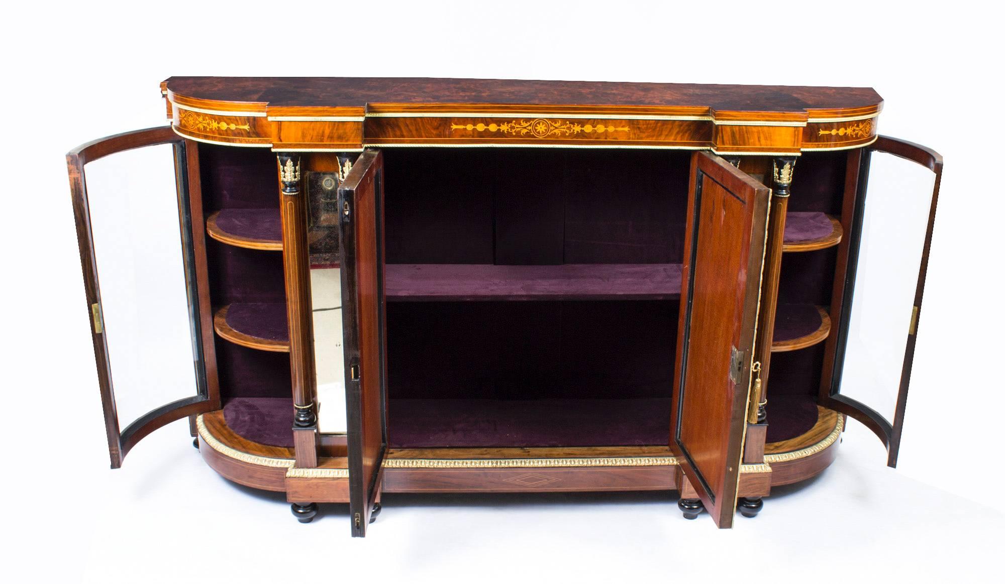 This is a superb antique Victorian burr walnut and inlaid credenza, circa 1880 in date.

The entire piece highlights the unique and truly exceptional pattern of the burr walnut extremely well and the walnut is complimented by the elegant inlaid