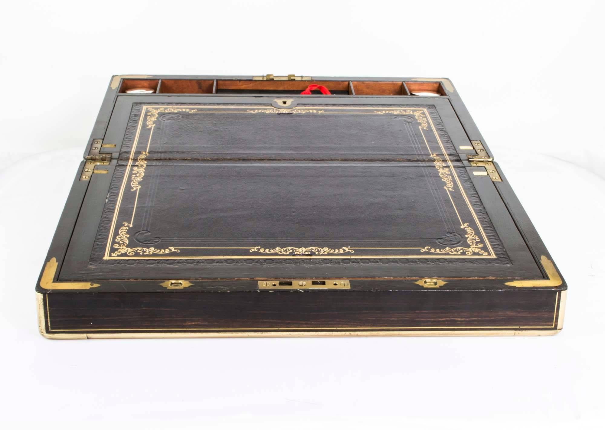 This is an antique Victorian coromandel and brass writing and stationery slope of rectangular shape, circa 1840.

The box is of rectangular shape with brass borders and a brass engraved plaque on the lid with an engraving that reads: Agnes M