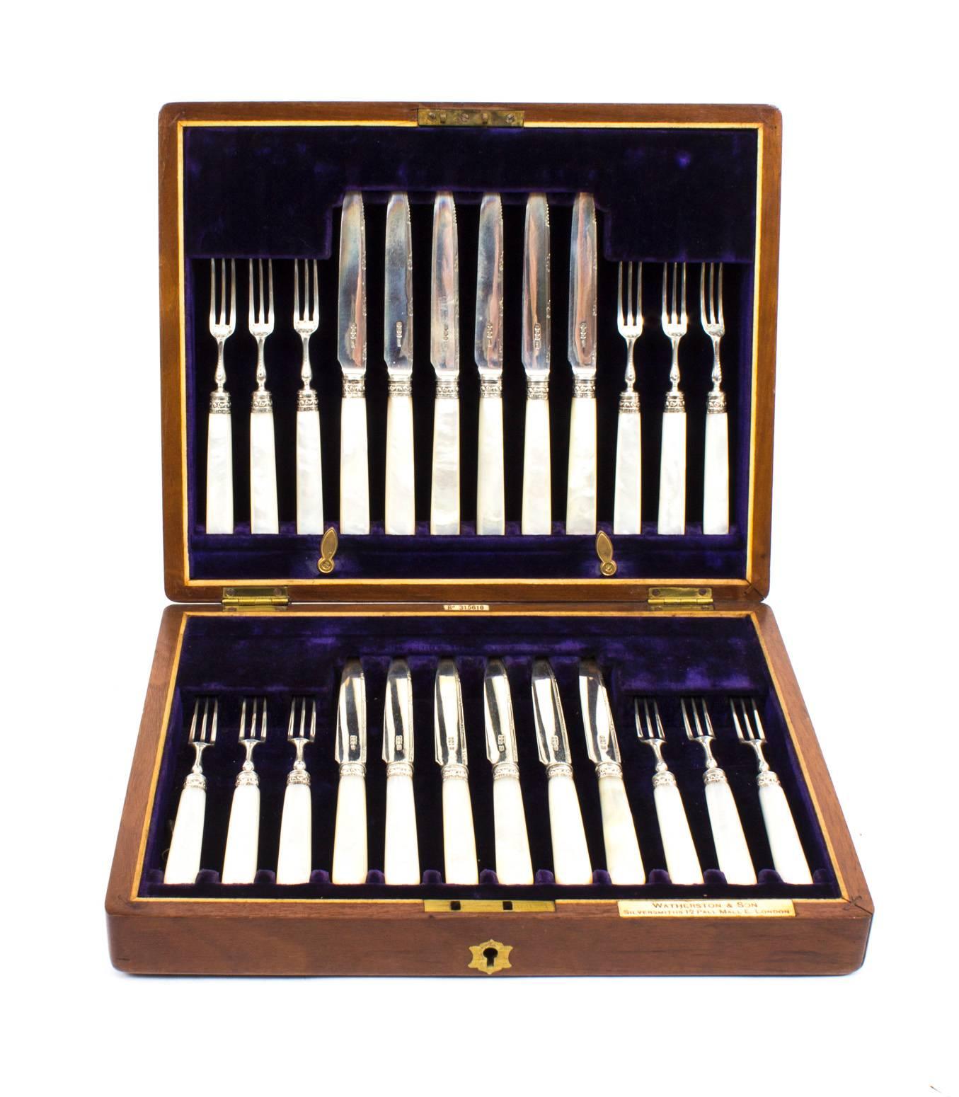 This is a beautiful antique and rare English mahogany boxed set of twelve sterling silver fruit knives and twelve sterling silver fruit forks, with hallmarks for Sheffield 1900 and the makers mark A&D for Allen & Darwin, Charles James Allen & Sidney