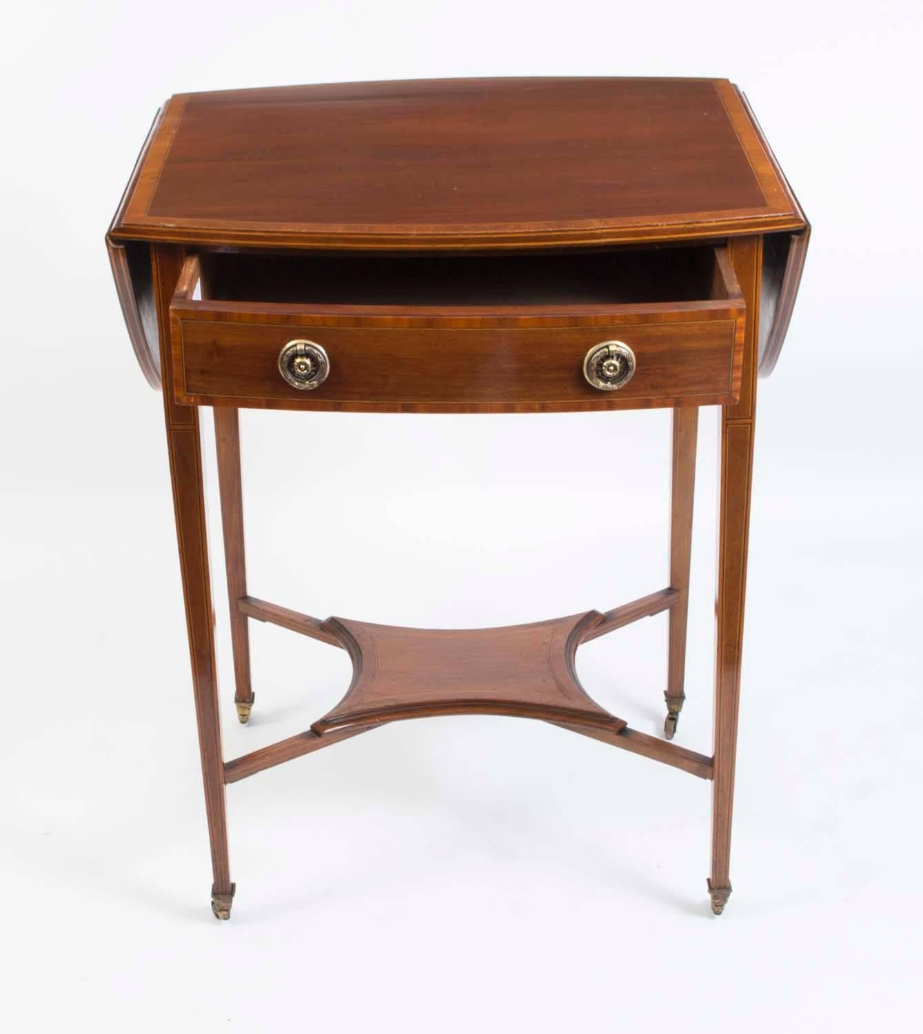 This is a delightful antique Edwardian mahogany and inlaid and crossbanded occasional table, circa 1900.

This is a drop-leaf table which has a useful drawer with two brass handles. 
 
The beautiful fine inlay compliments the mahogany with the whole