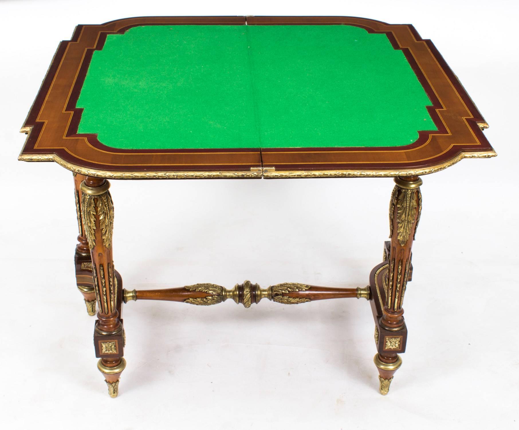 This is a magnificent antique French mahogany, kingwood, satinwood, marquetry and ormolu-mounted card table, circa 1870 in date.

The craftsmanship and finish are second to none, and the table features exquisite inlaid marquetry of musical