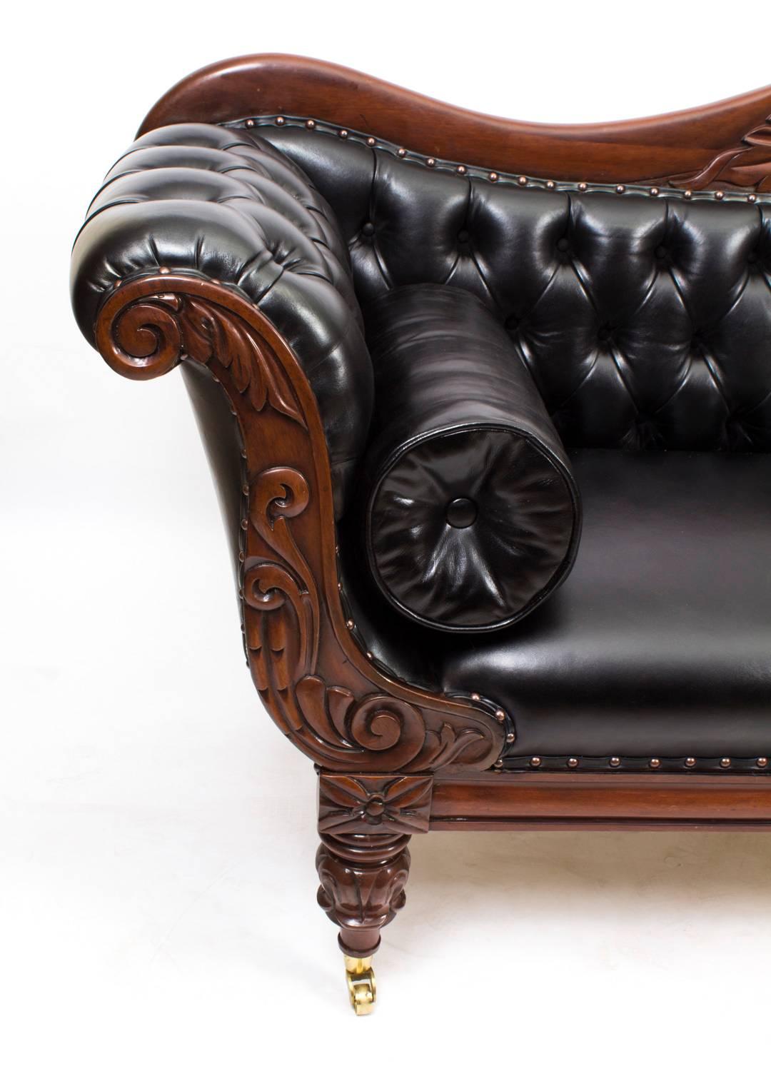 This is a superb quality antique William IV double scroll end mahogany and leather sofa, circa 1830 in date.

At this time, England was importing the best quality mahogany from its colonies, the frame and the baluster turned legs are constructed