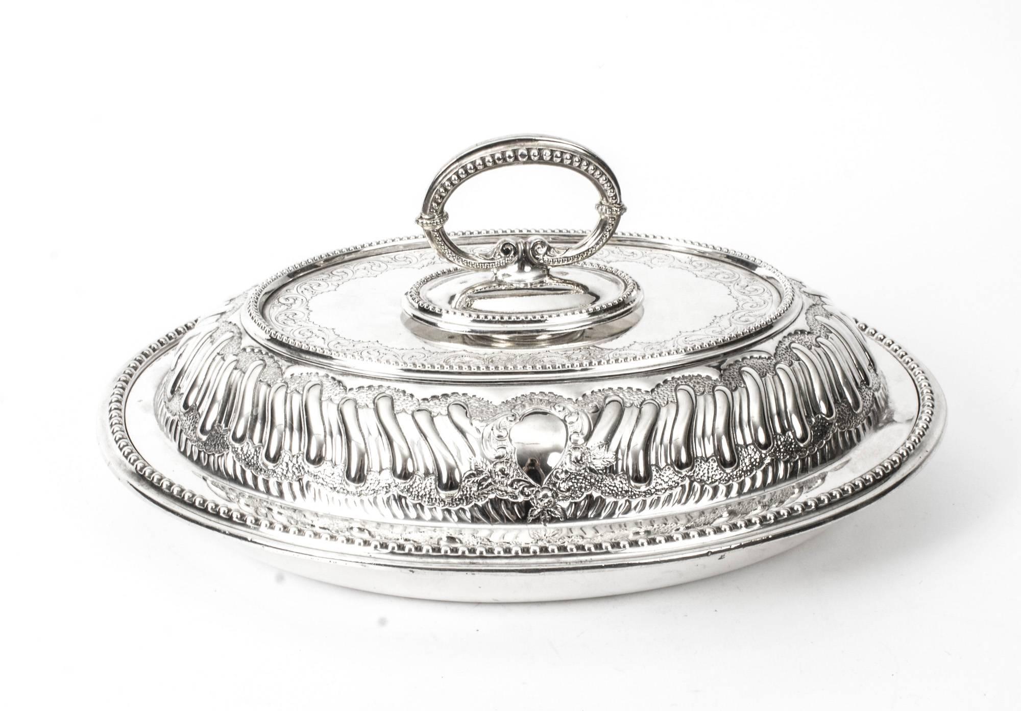 This is an exquisite and rare antique pair of English silver plated entree dishes, circa 1850 in date, and bearing the makers mark of the world renowned silversmiths "Mappin Brothers, 66 Cheapside, 220 Regent Street, London &
