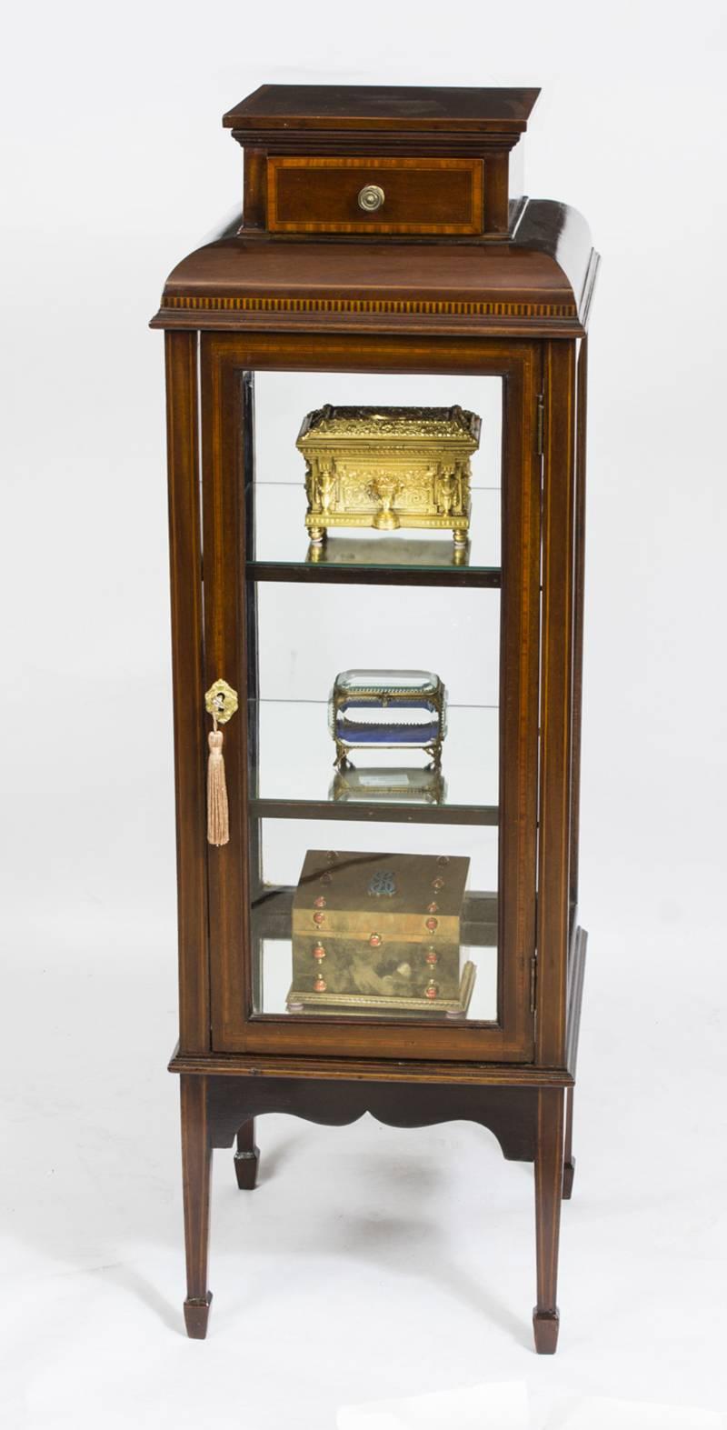 This is an exquisite antique Edwardian mahogany and inlaid square upright display cabinet, circa 1890 in date.

This cabinet is elegantly crafted in mahogany beautifully crossbanded in satinwood that is bordered with boxwood and ebony