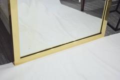 Pair of Brass Framed Antiqued Mirrors