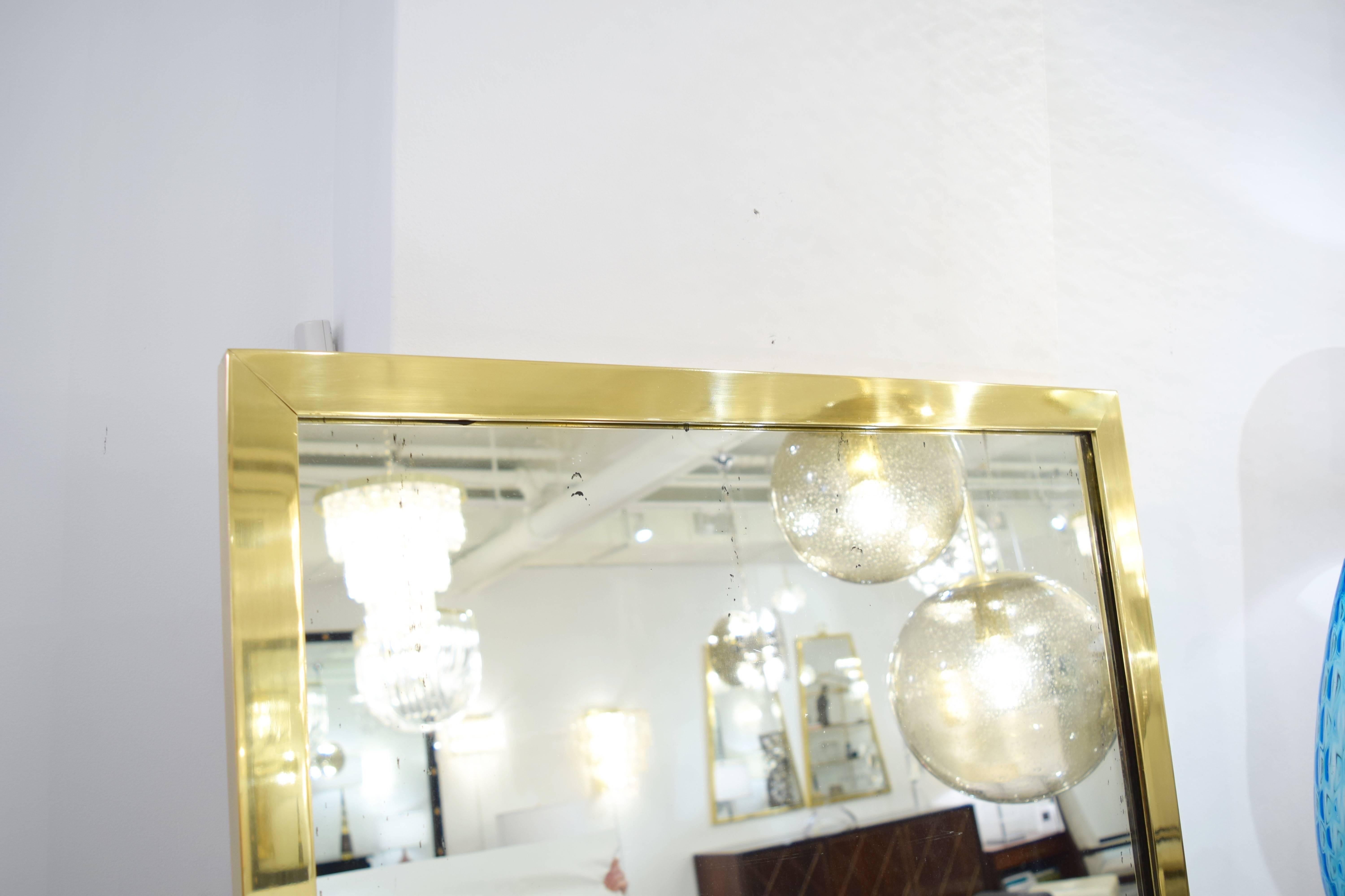 Mid-Century Modern Pair of Brass Framed Antiqued Mirrors For Sale