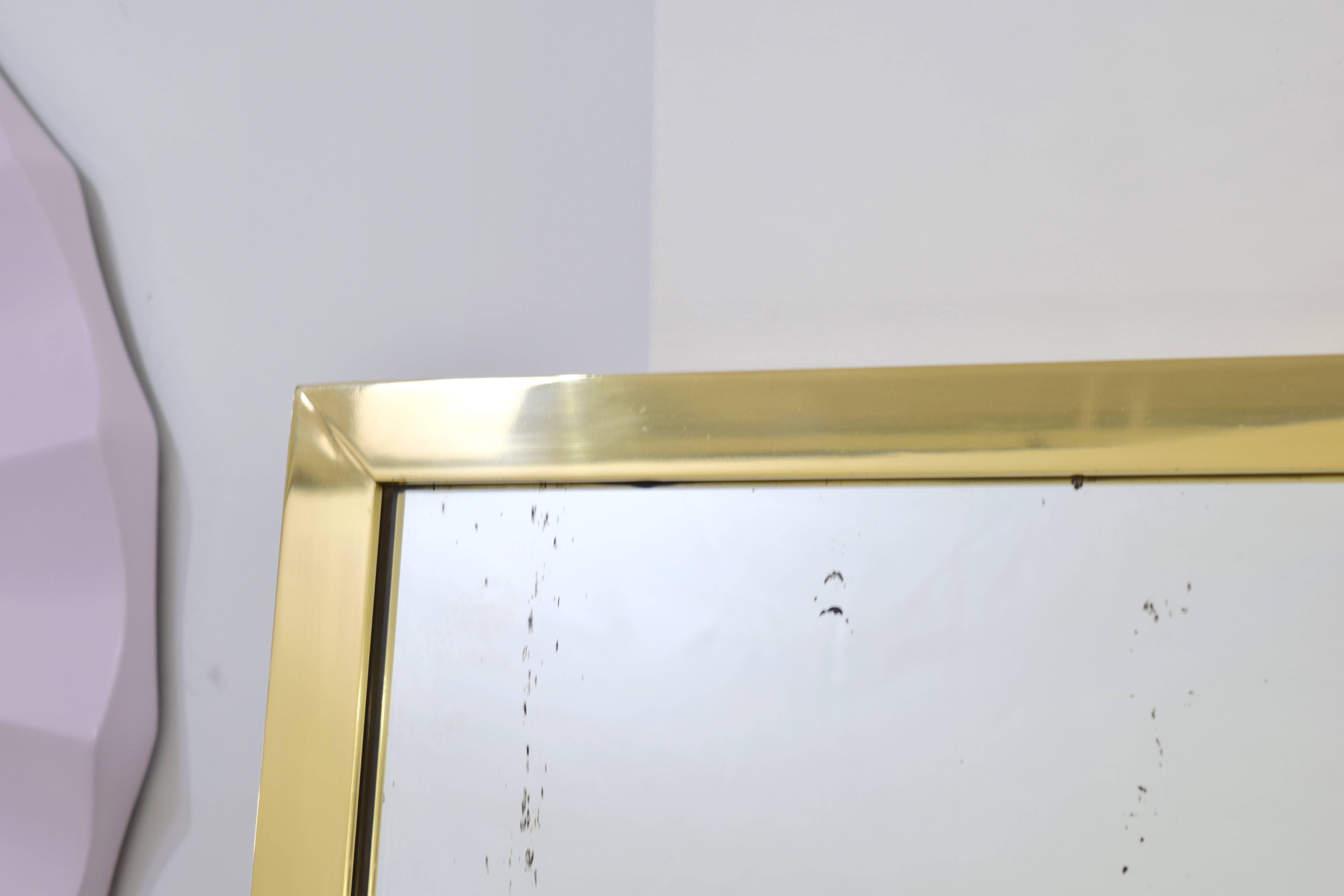 Contemporary Pair of Brass Framed Antiqued Mirrors For Sale