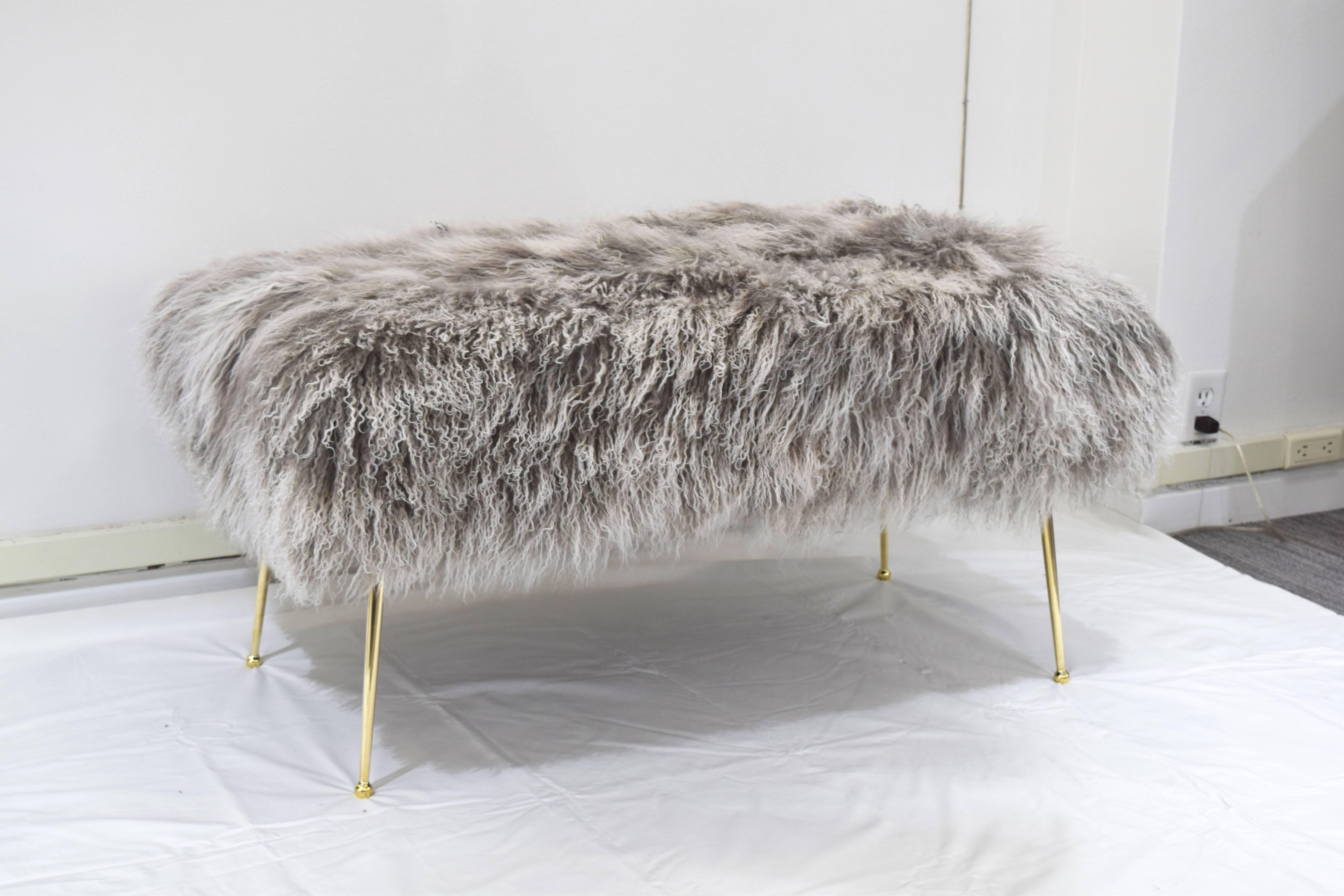 Custom Vivier bench designed by Irwin Feld Design for CF Modern. Featuring solid brass polished tapered legs with a custom upholstery top (shown here in a grey Mongolian fur). Available COM and in other sizes. Legs available nickel plated as well