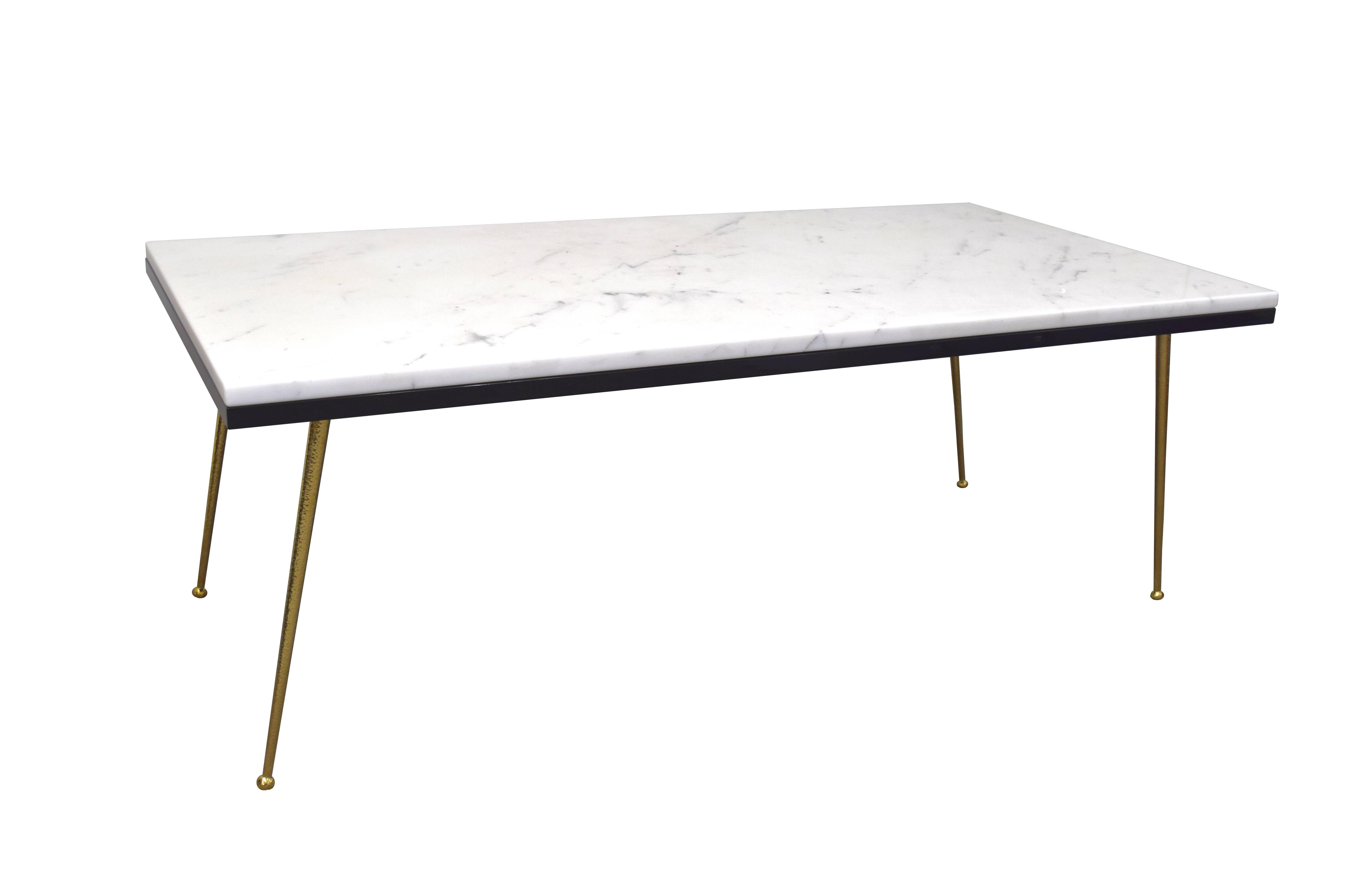The marble Vivier coffee table, designed by Irwin Feld design for CF MODERN, is a great way to center company around a Classic conversation piece. The table is made from a slab of Carrara marble over a high gloss, black lacquered sub top. Standing