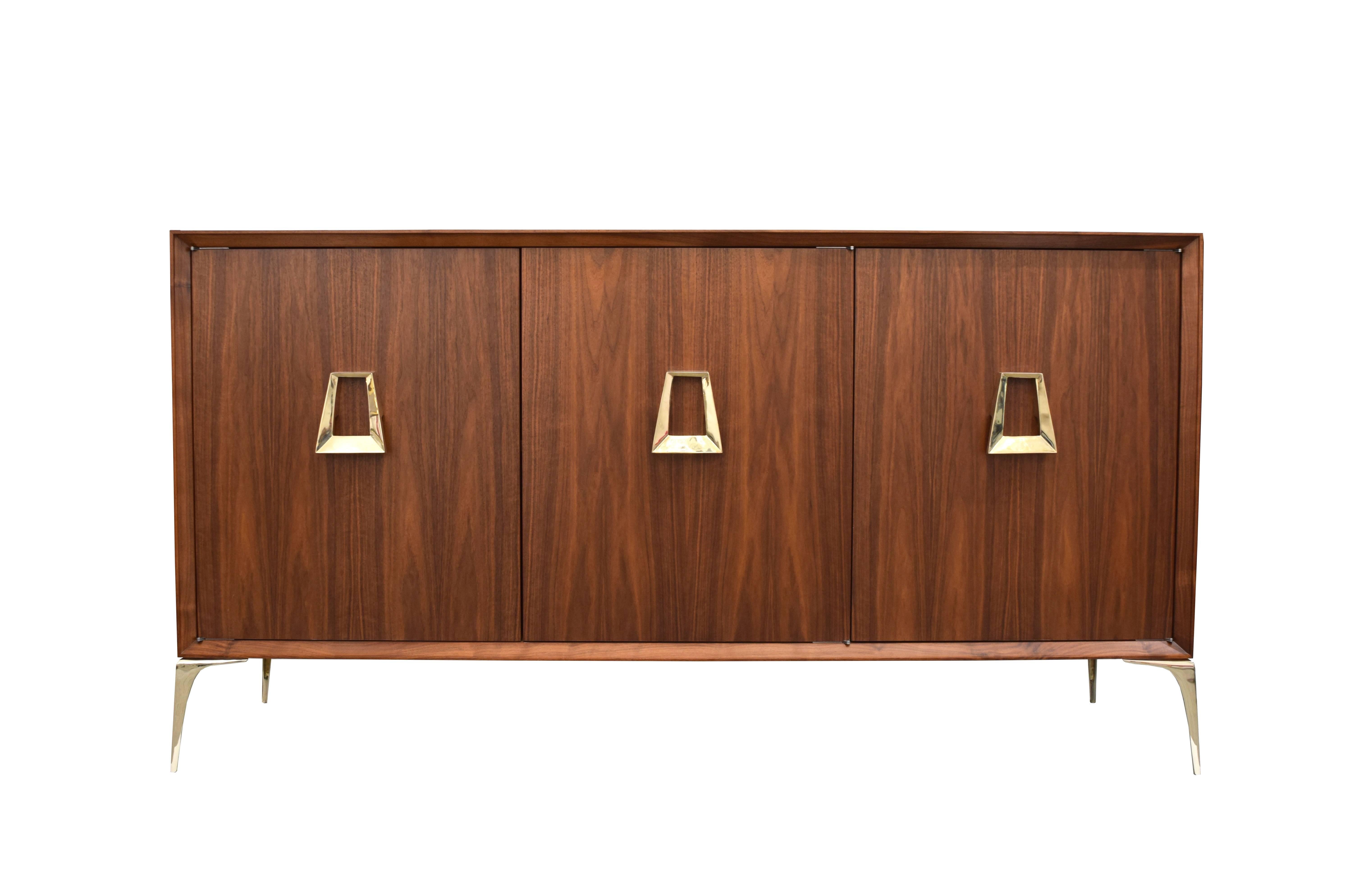 Irwin Feld Design for CF Modern presents the Stiletto credenza shown in natural walnut, with our solid brass  8