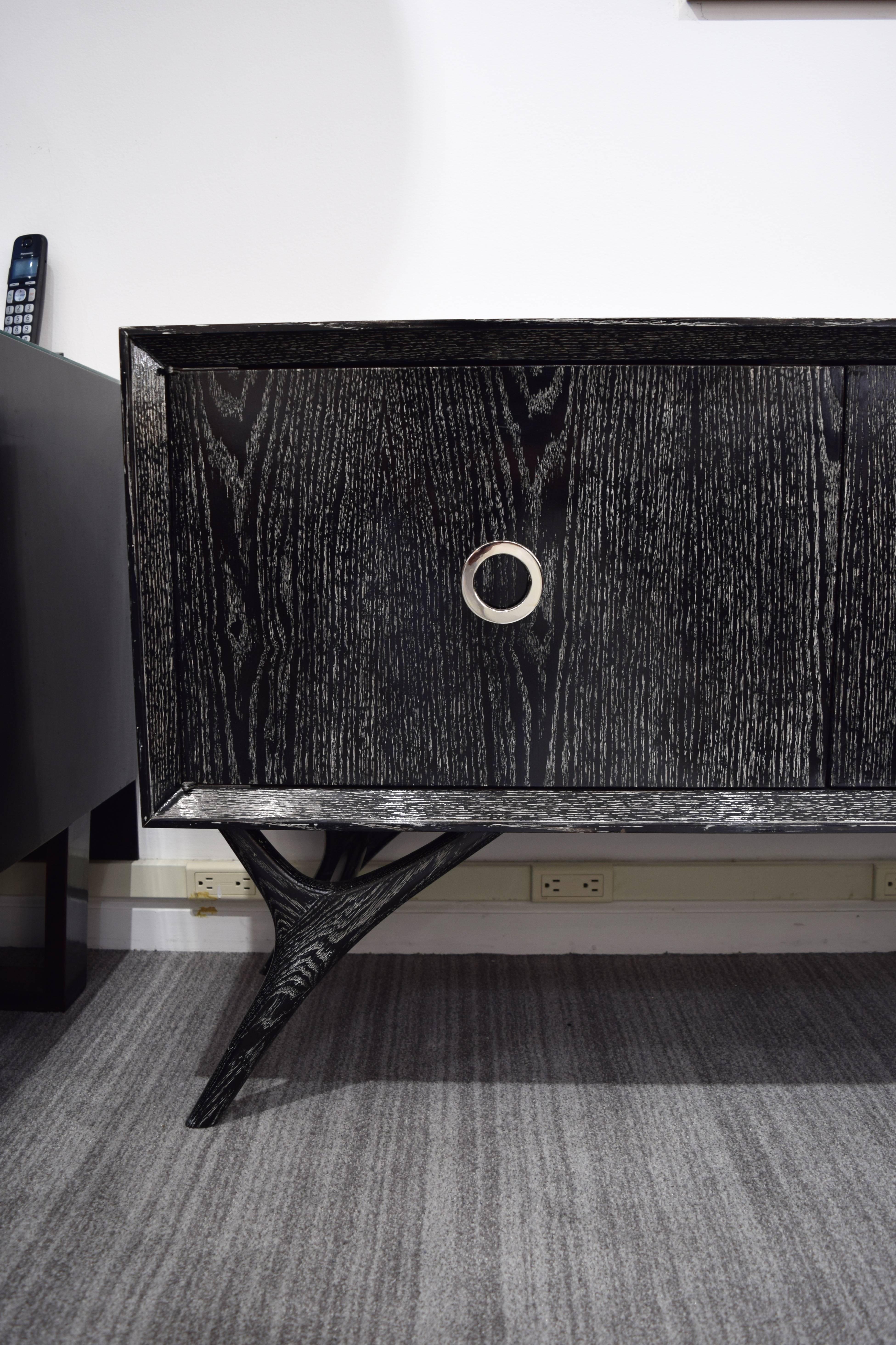 By popular request, Irwin Feld Design for CF Modern presents the Finn Leg Credenza, shown here is black cerused oak with nickel hardware. We can configure this credenza to your particular size, add a drawer, shelves or open space. Available in CFM