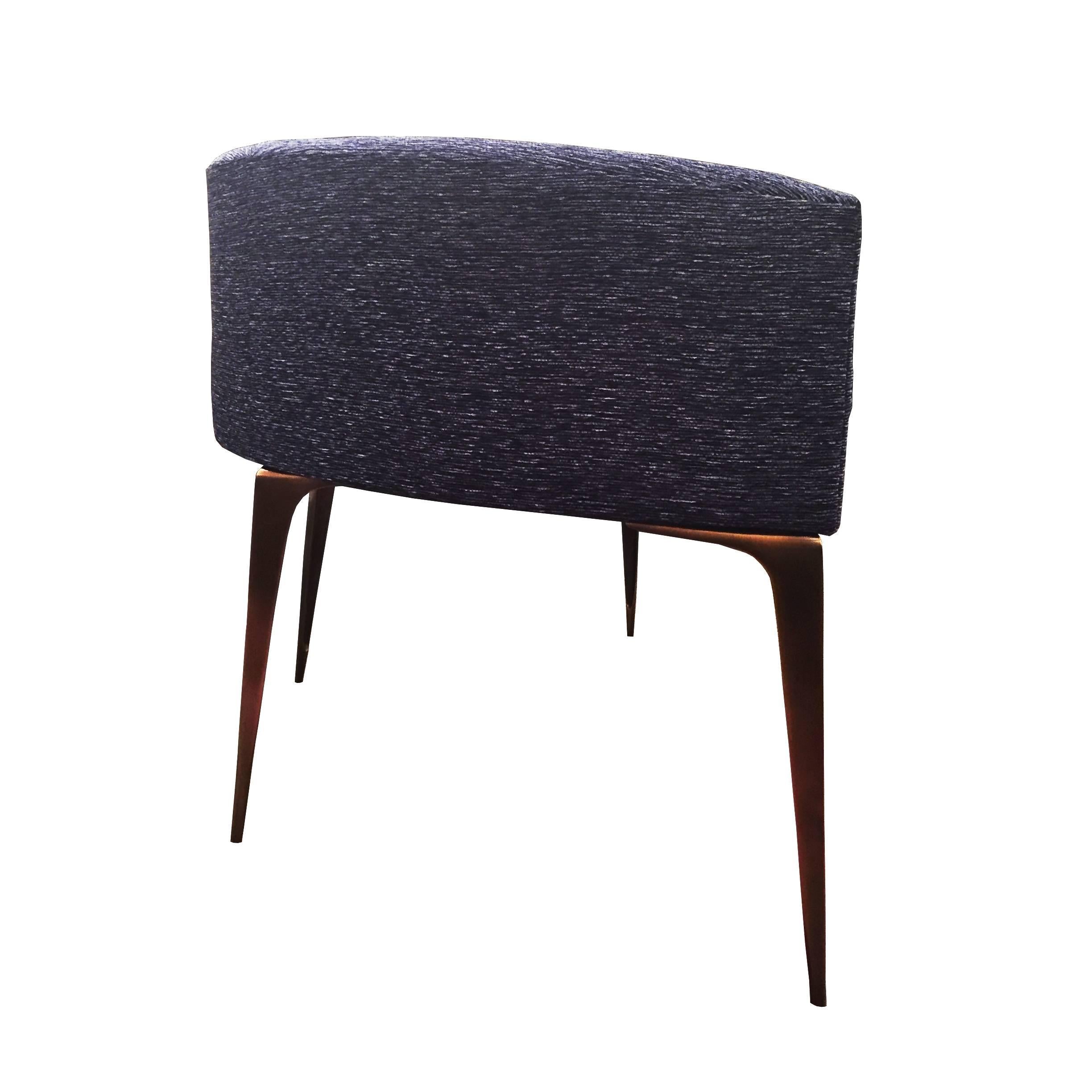 The slice ottoman is the latest versatile concept in casual seating by Irwin Feld for CF Modern. Made exclusively in New York, the slice features our hand lathed solid brass stiletto legs and a low back . Shown in Arc-Com sapphire chenille.