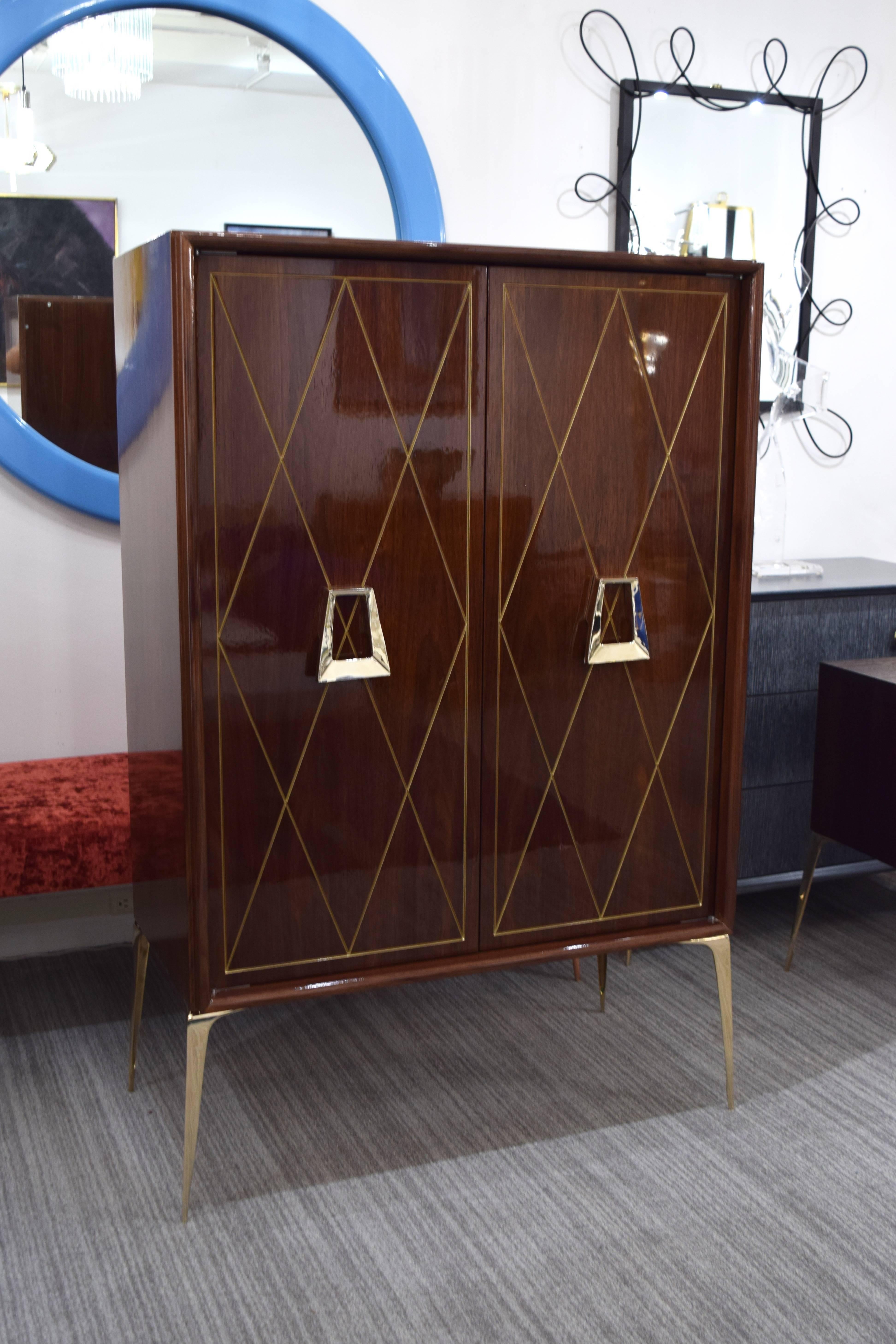 Superb incised diamond front bar cabinet by Irwin Feld Design for CF modern. Fabricated in the USA of walnut (as shown) customized to your perfect specifications. Shown with a beautiful front geometric golden carving with polished brass knocker
