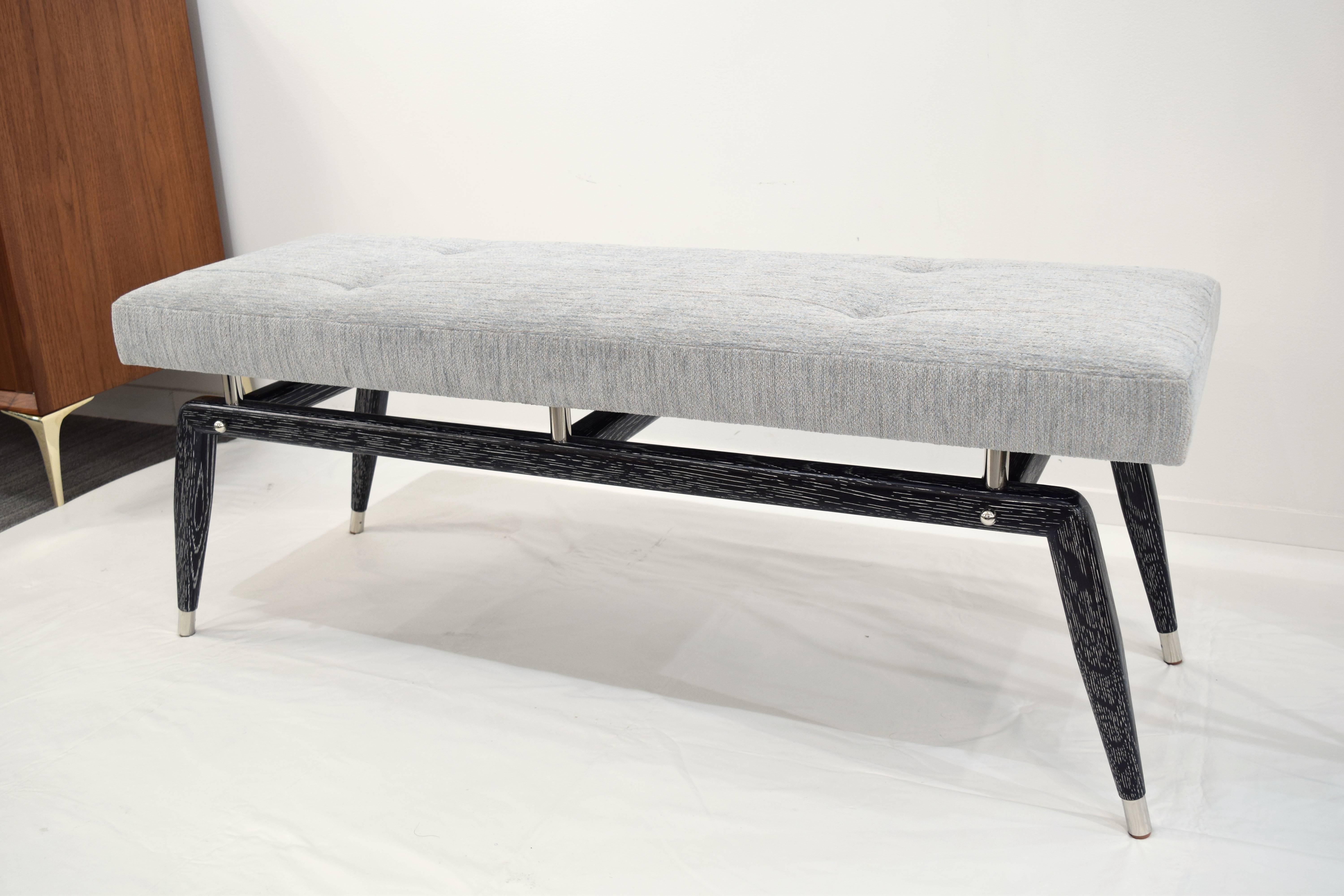 The elegantly appointed custom Formation bench designed by Irwin Feld Design for CF Modern boasts clean and sculptural lines. The solid wood base is made of oak and cerused in black, has custom nickel sabots, risers and finials.  COM and COL