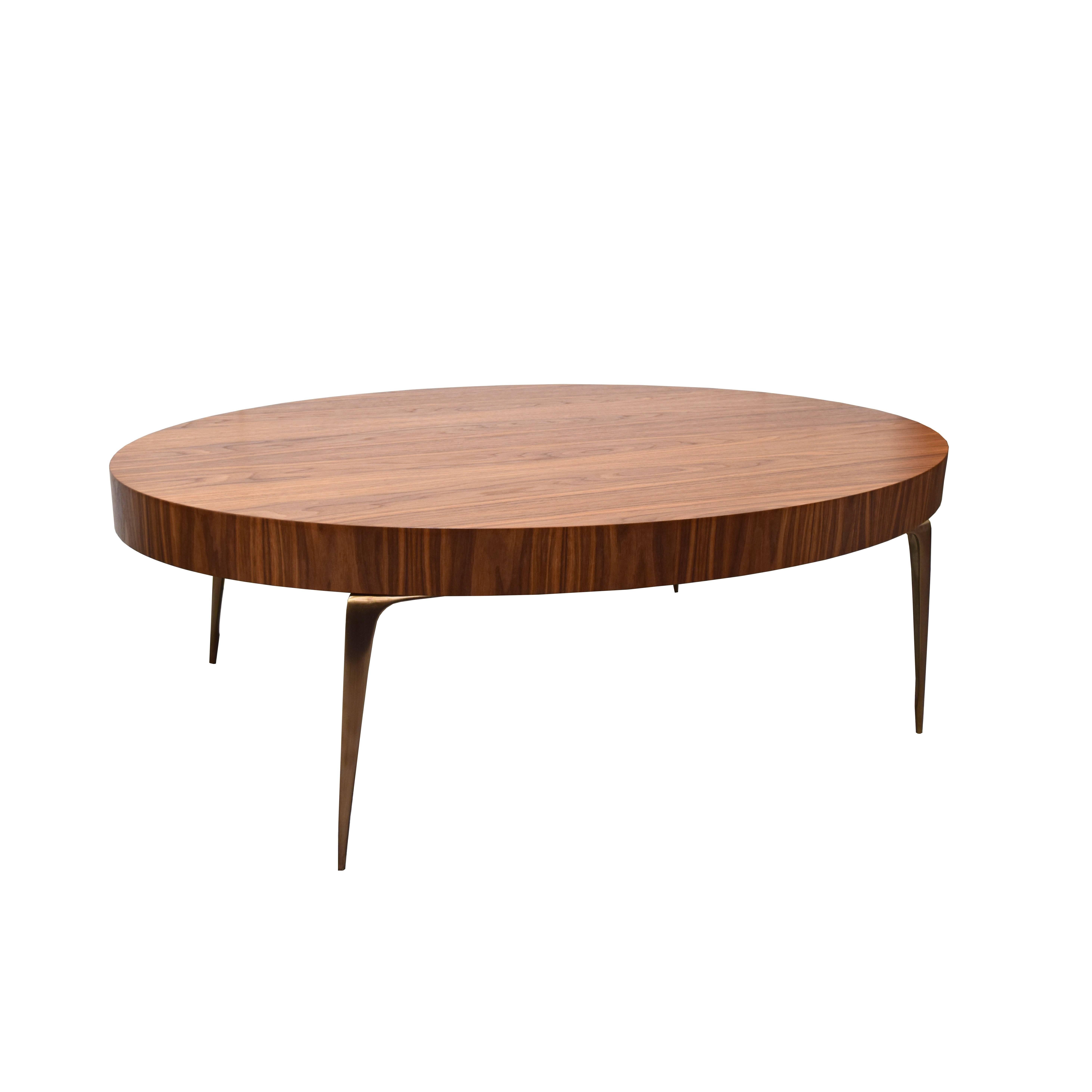 The Oval Stiletto Coffee Table by Irwin Feld for CF MODERN is strikingly simple in natural walnut. The gorgeous wood grain is paired with four antiqued brass stiletto legs and and will stand out as a conversation piece in a living space or hall.