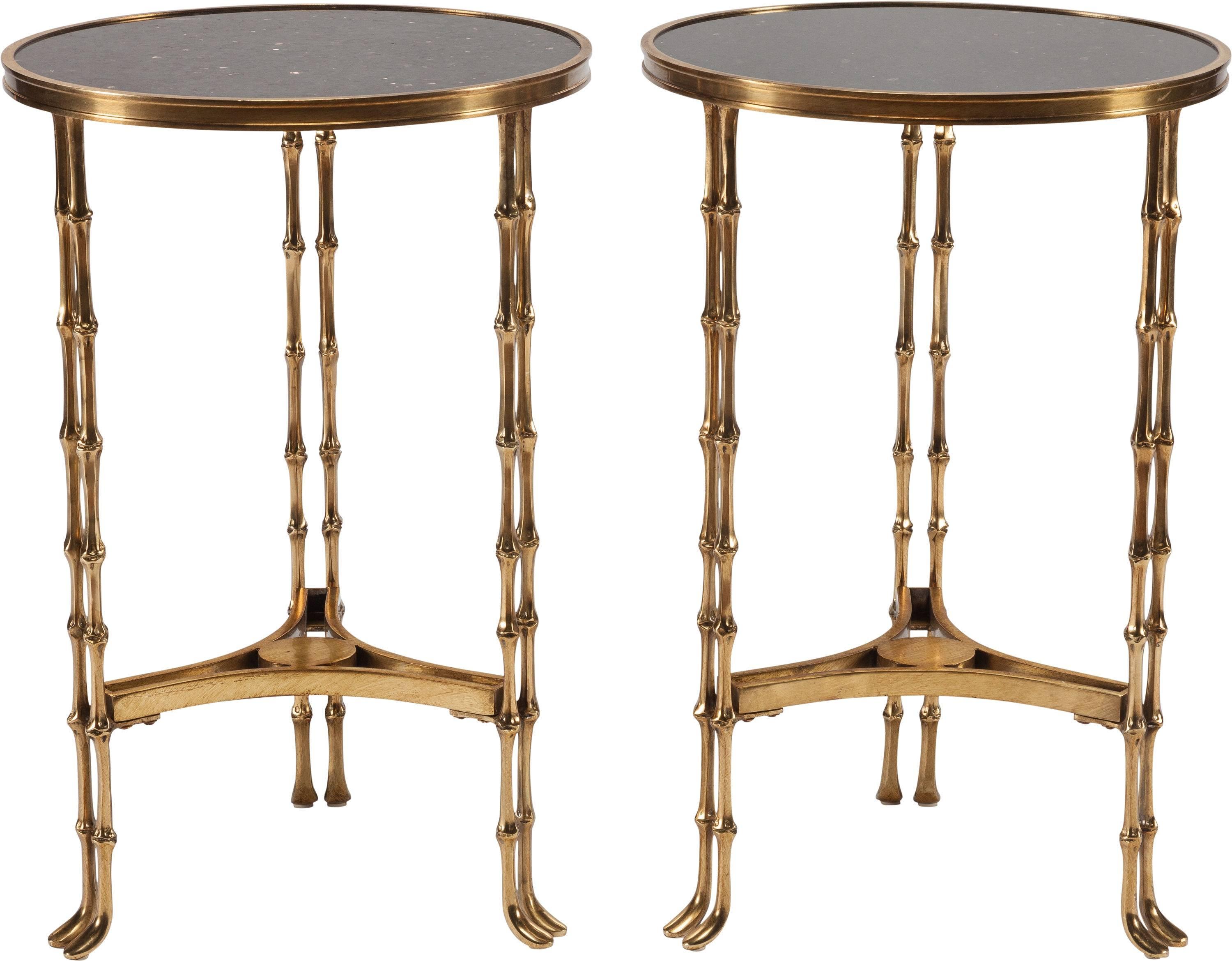 Elegant antique pair of neoclassical bronze doré and granite side tables; crafted in France, circa 1900, both tables feature 