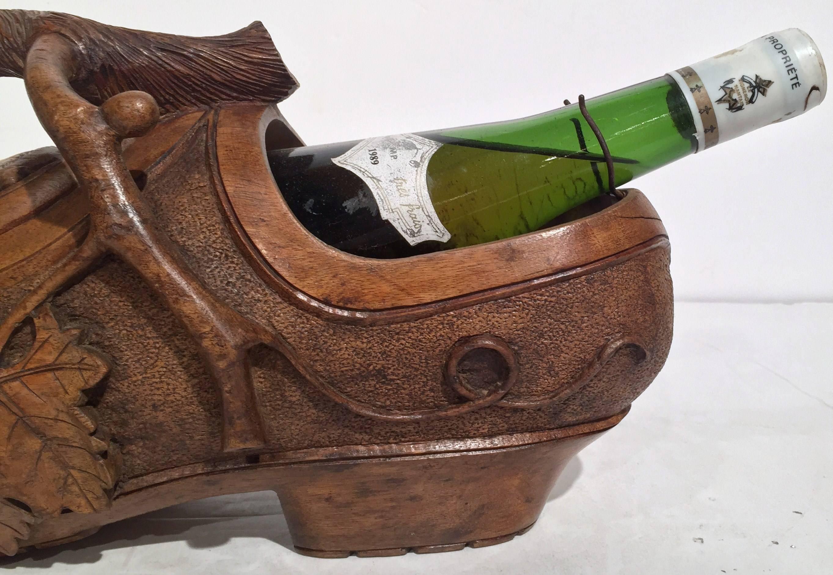 Black Forest Early 20th Century French Carved Walnut Wine Bottle Holder Clog with Vine Decor For Sale