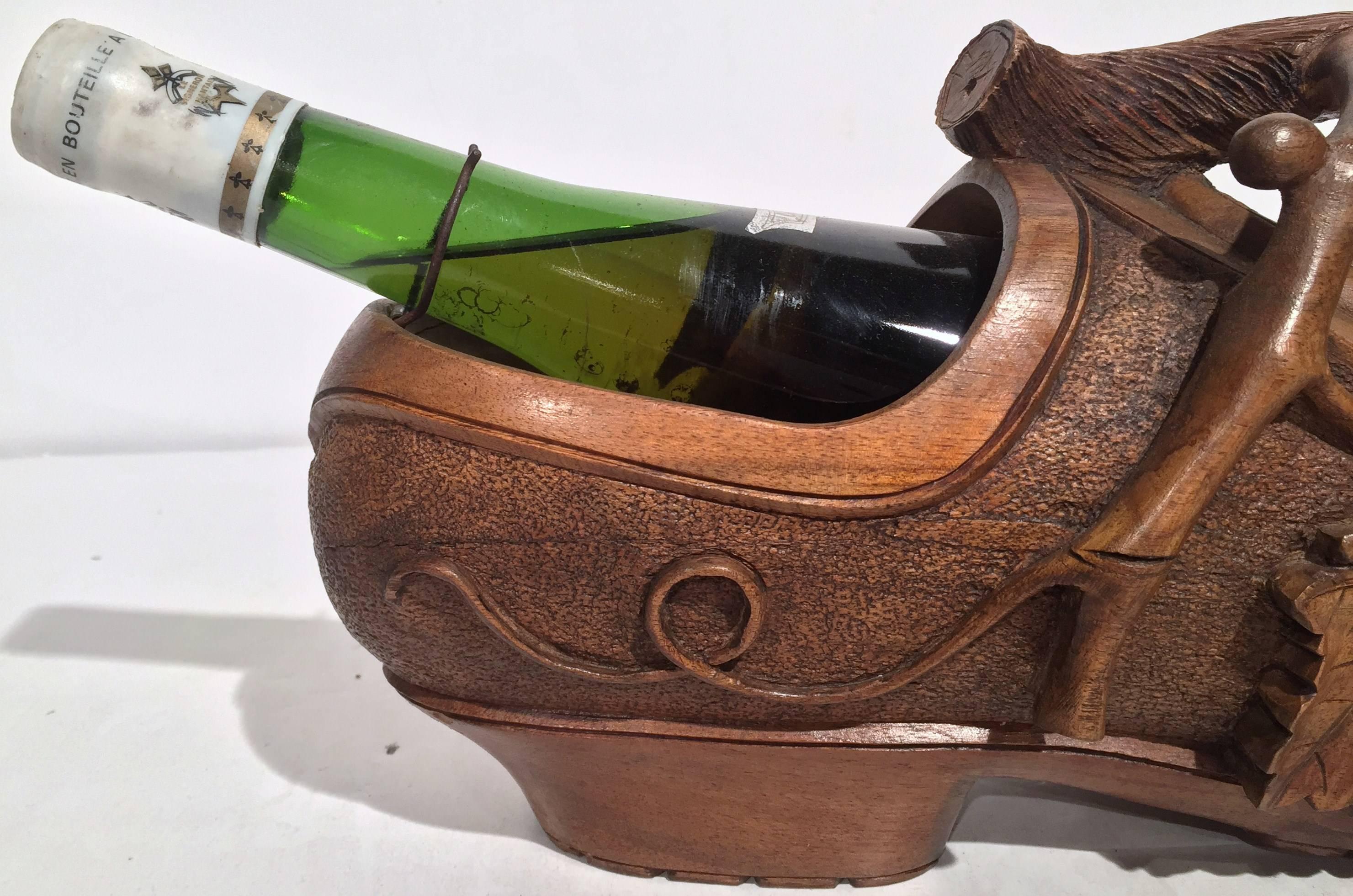 Patinated Early 20th Century French Carved Walnut Wine Bottle Holder Clog with Vine Decor For Sale
