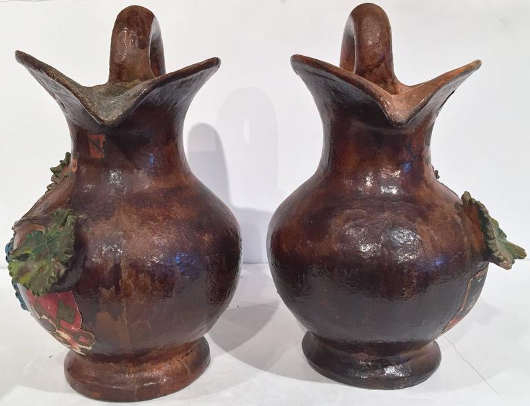 Pair of 19th Century French Painted Barbotine Wine Pitchers with Grapes