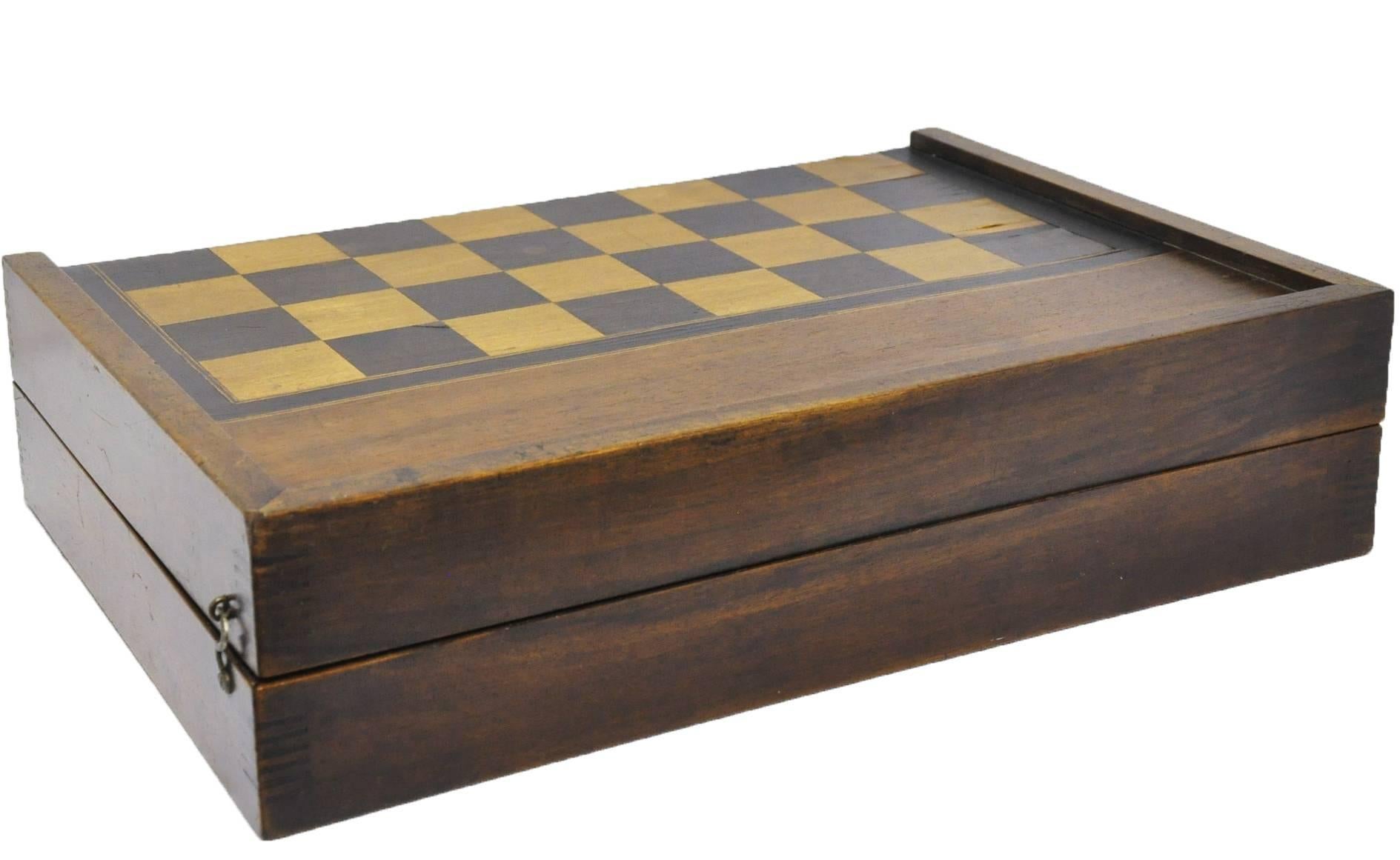 This antique fruit wood checkers and backgammon game was crafted in France, circa 1880. The game box with a green felt bottom, is complete with its original dices and leather dice holder. The checkers board is in a classic, traditional style with