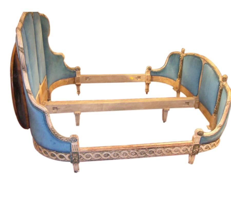 Elegant antique King or Queen-size bed frame from France, circa 1830. Bow front with Fine carving and original painted finish. All it needs is a custom mattress.
