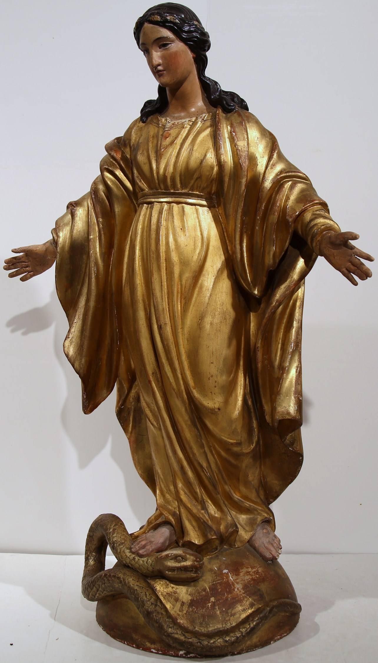 This beautiful, antique statue of the Virgin Mary was created in France, circa 1820. Embellished with gold leaf finish, the Classic piece is beautifully ornate and also has wonderful details on her robe and throughout her face, hair and hands. Mary