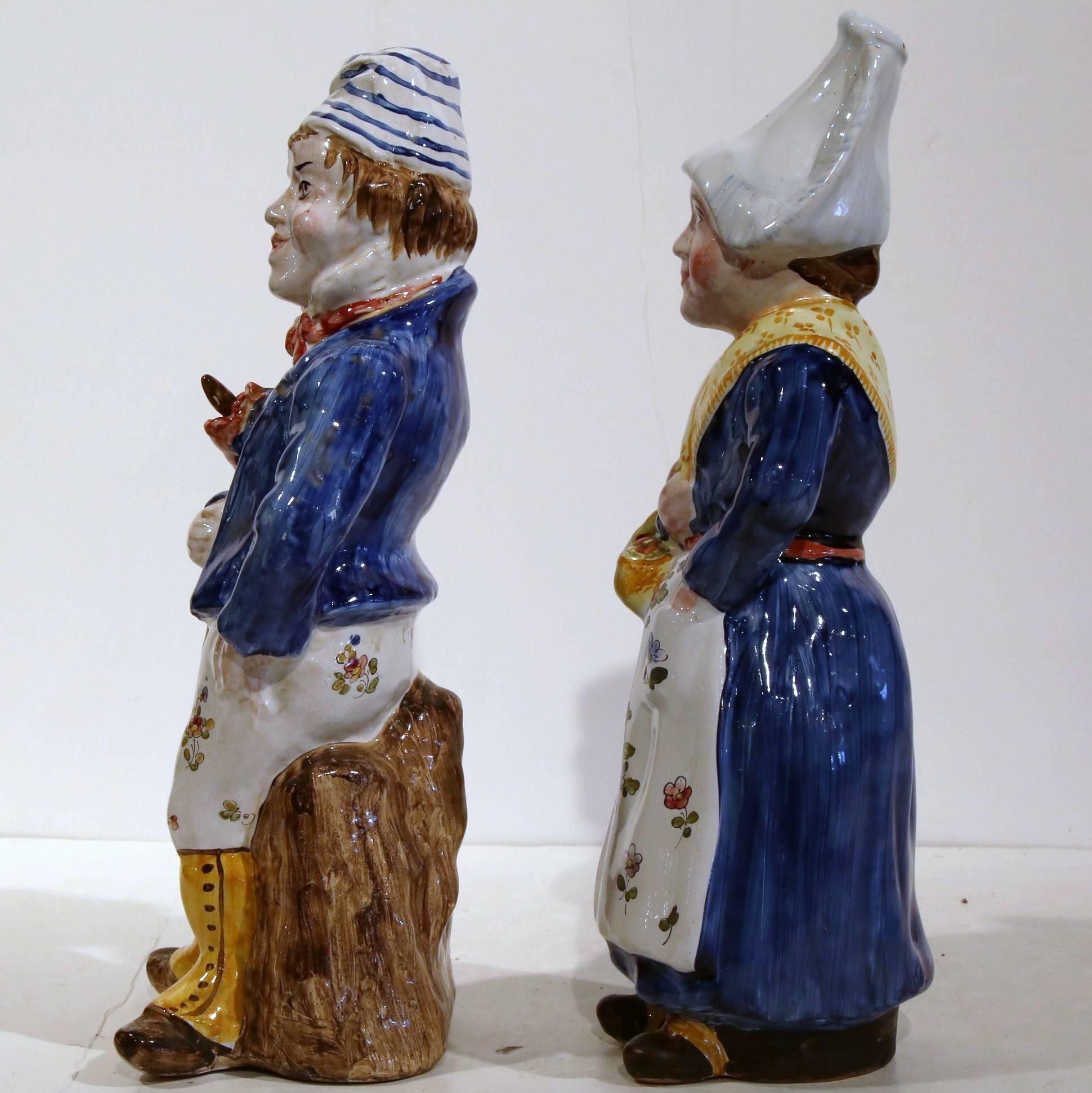 Pair of antique colorful hand-painted Majolica figurines from France; crafted, circa 1890, the sculptures features a man and a woman in traditional clothing. Excellent condition with wonderful colors with markings QR on the bottom.
Measures: 5