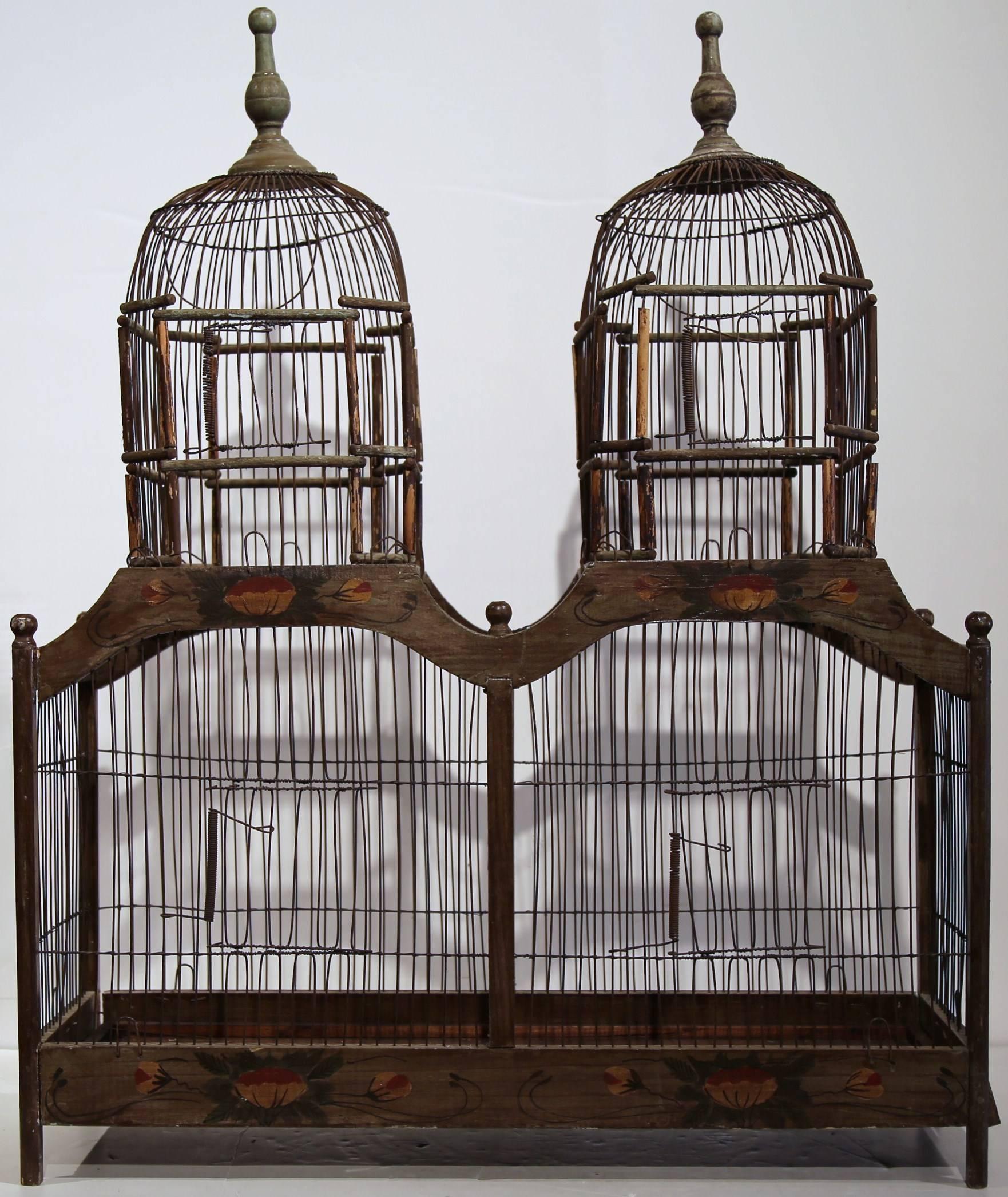 Late 20th century birdcage from France with colorful painted motifs, circa 1970. Removable tray. Appeared to have not been used much!