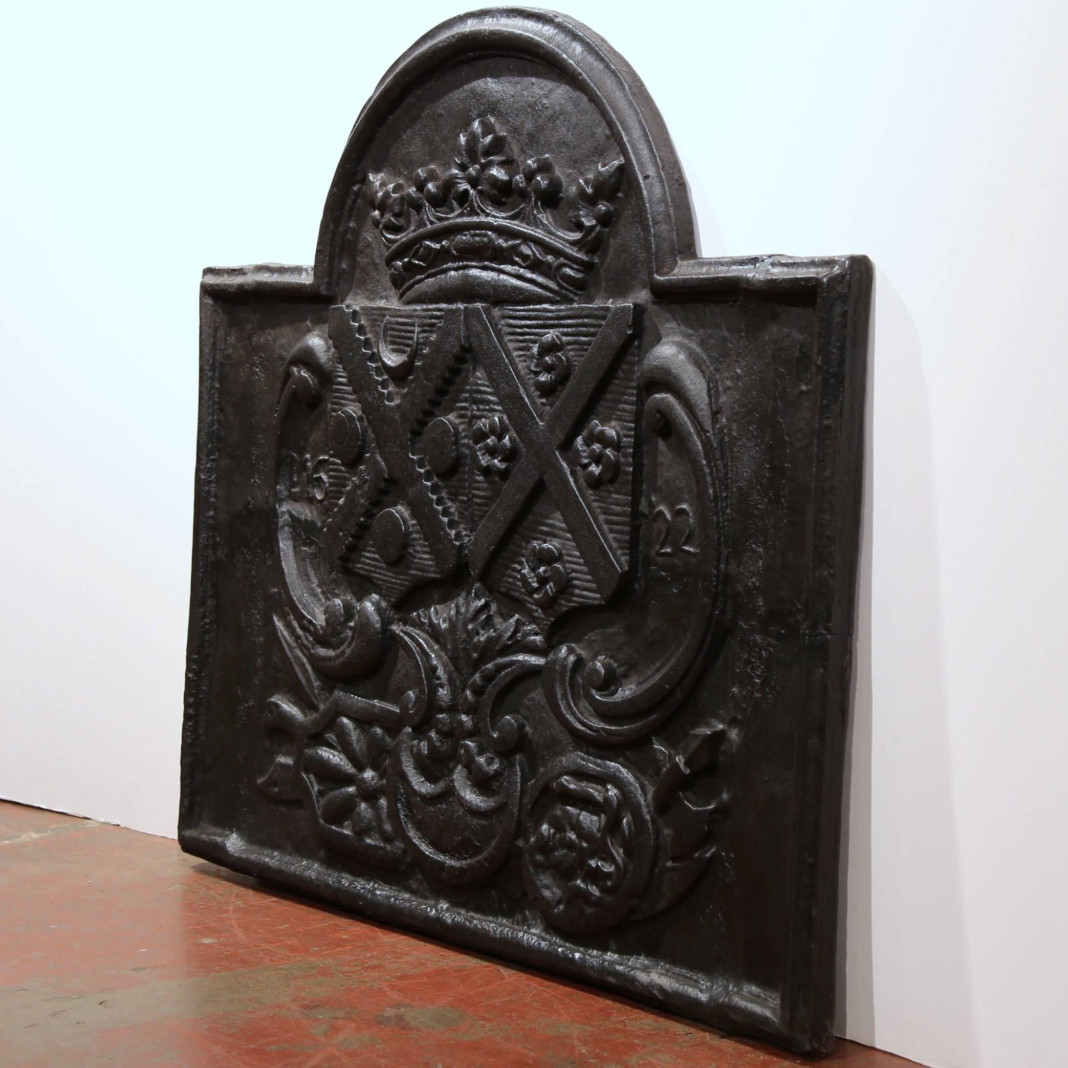 Monumental iron fire back from the Perigord Region (Southwest France), dated 1622, featuring a "couronne de Marquis" (Marquis' crown) with coat of arms of 2 families.
This is the alliance of Thomas d'Armes de Choisy, Marquis of