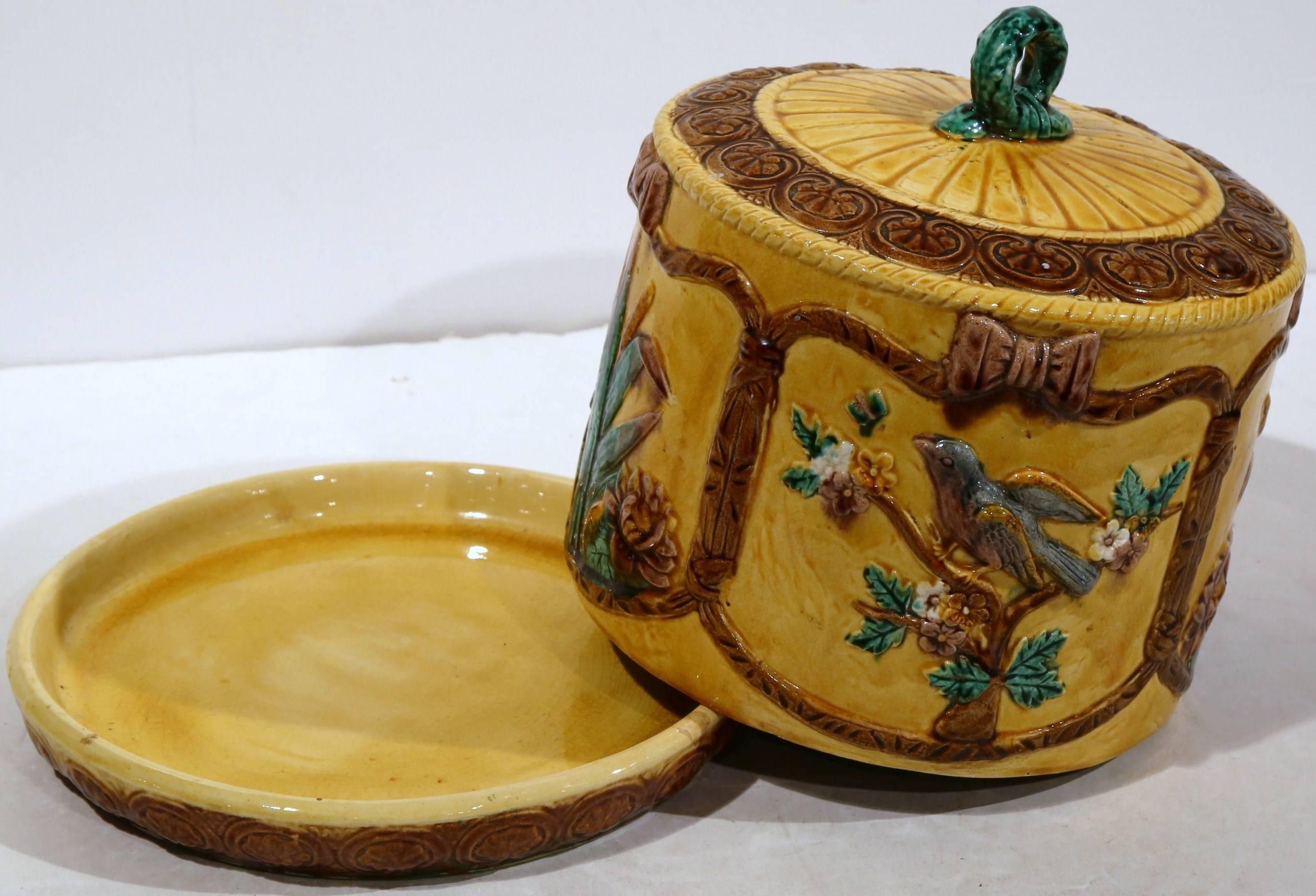 Colorful two-piece antique hand-painted Majolica cheese dome from France, circa 1880. Great condition with beautiful and rich colors.