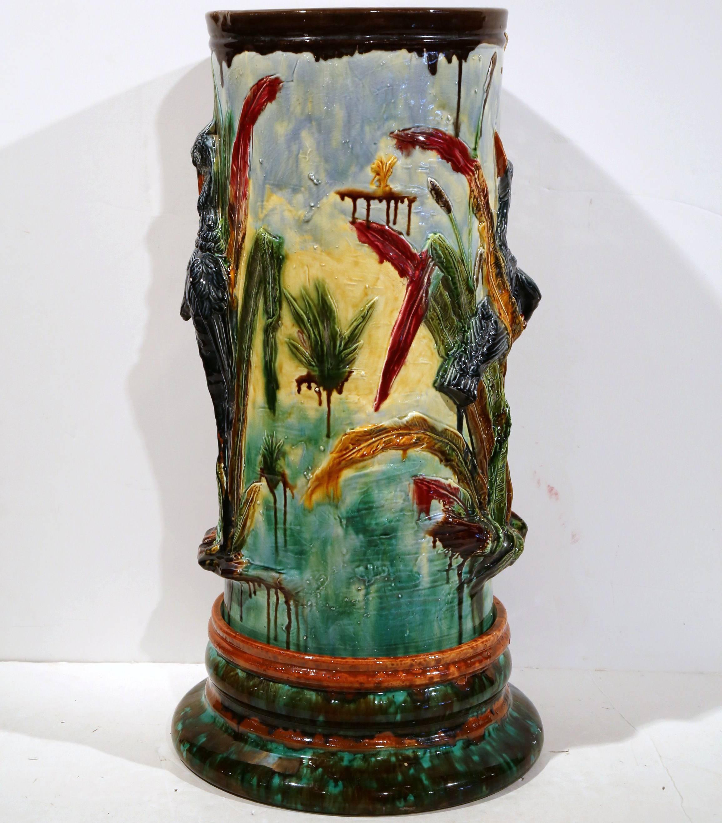 Wonderful antique Majolica two-piece umbrella stand with birds and reeds from France, circa 1870. Rich colors with different birds on both sides. Beautiful condition.