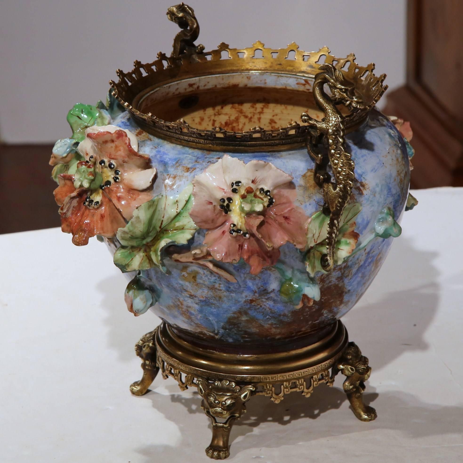 Colorful antique hand-painted Majolica cache pot from France, circa 1870. This vase has beautiful painted flowers with bronze dragons handles and base. Very good condition.