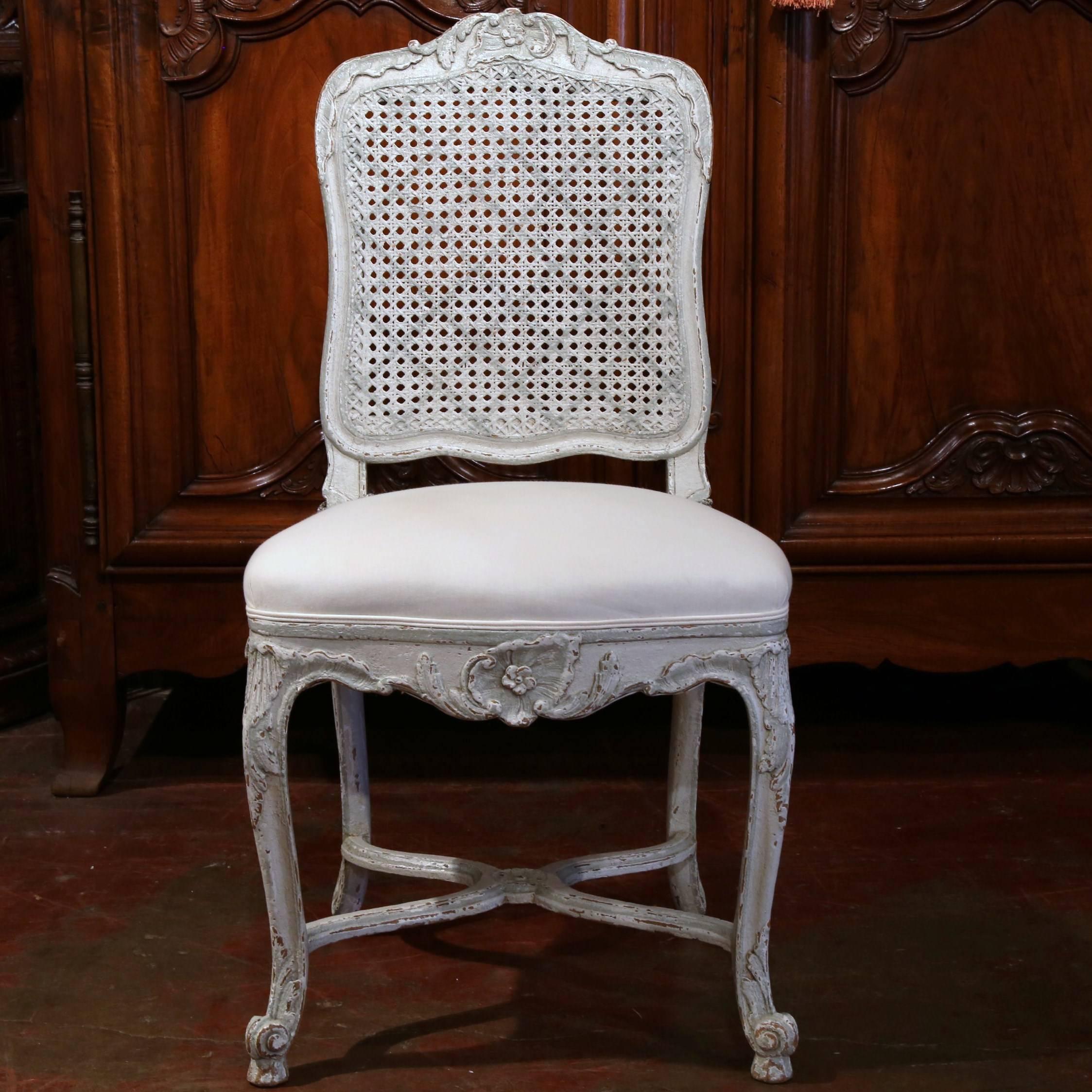 Fine pair of antique Louis XV side chairs from France, circa 1880. Covered with white muslin, these desk or bedroom chairs have beautiful carving, cabriole legs, stretcher and grey painted cane back. Excellent condition. Can be sold separately.