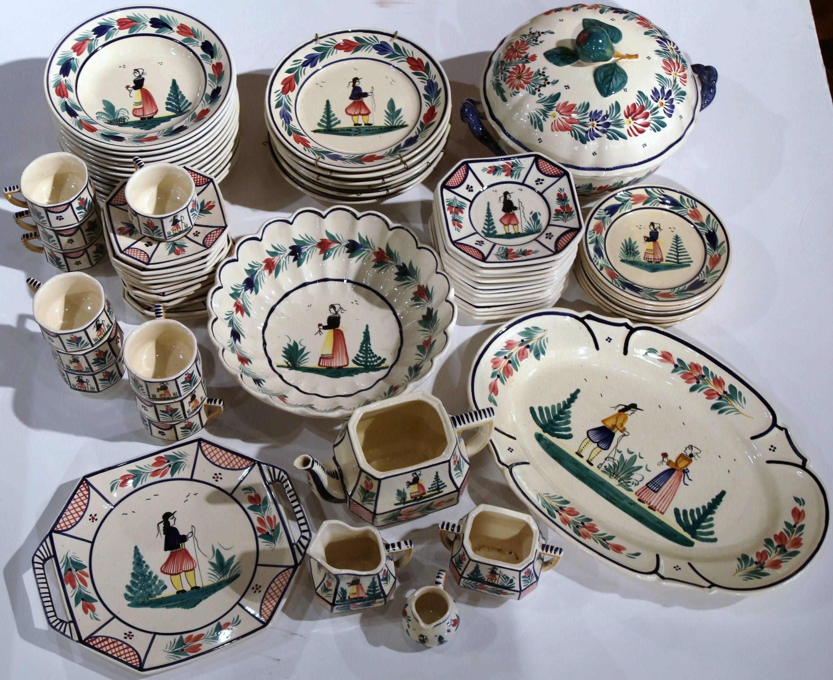 These colorful, antique dishes were crafted in Quimper, France circa 1880. The set is about 70 items total and includes plates, coffee mugs, a serving tray, a soup tureen, and more. The set is a refined addition to your dining table, and is just as