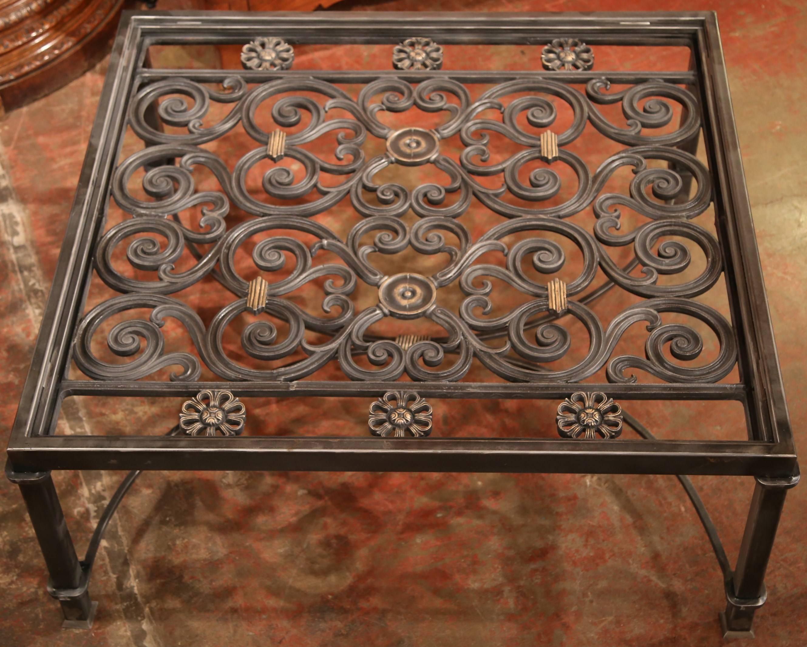 This iron base would make an elegant coffee table in your den or formal living room. Almost square in shape, the low table was created from a pair of ornate, antique gates which have been welded together. (In France, most of these balconies were