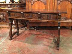 Early 20th Century Spanish Carved Walnut Console with Drawers and Iron Stretcher
