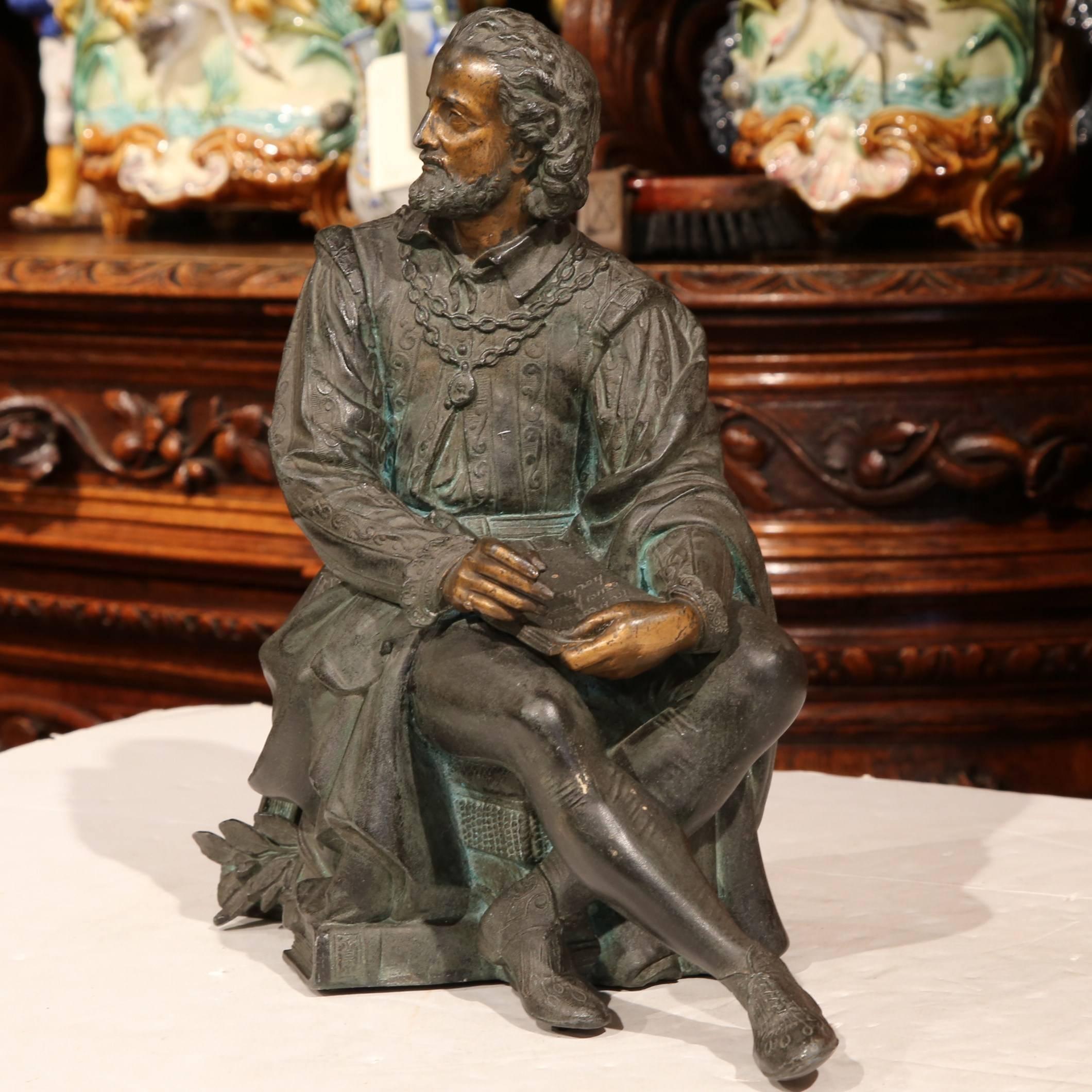 Accessorize your study or den with this elegant antique spelter statue from France. Crafted circa 1860, the detailed metal sculpture features a classic philosopher figure in a seated position deep in thought and holding a book with engraved Latin